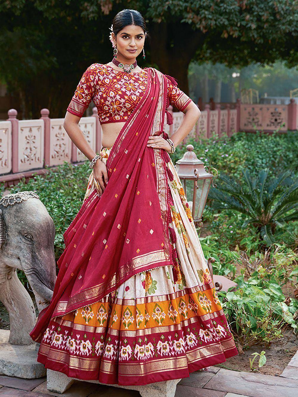 Red and cream printed lehenga choli with floral embroidery, perfect for Indian ethnic occasions