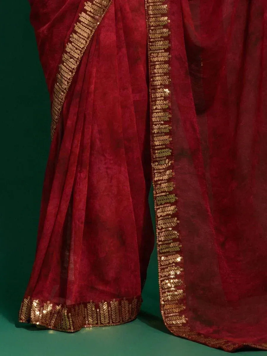 Rich maroon saree with gold sequin border, elegant ethnic wear for festive occasions