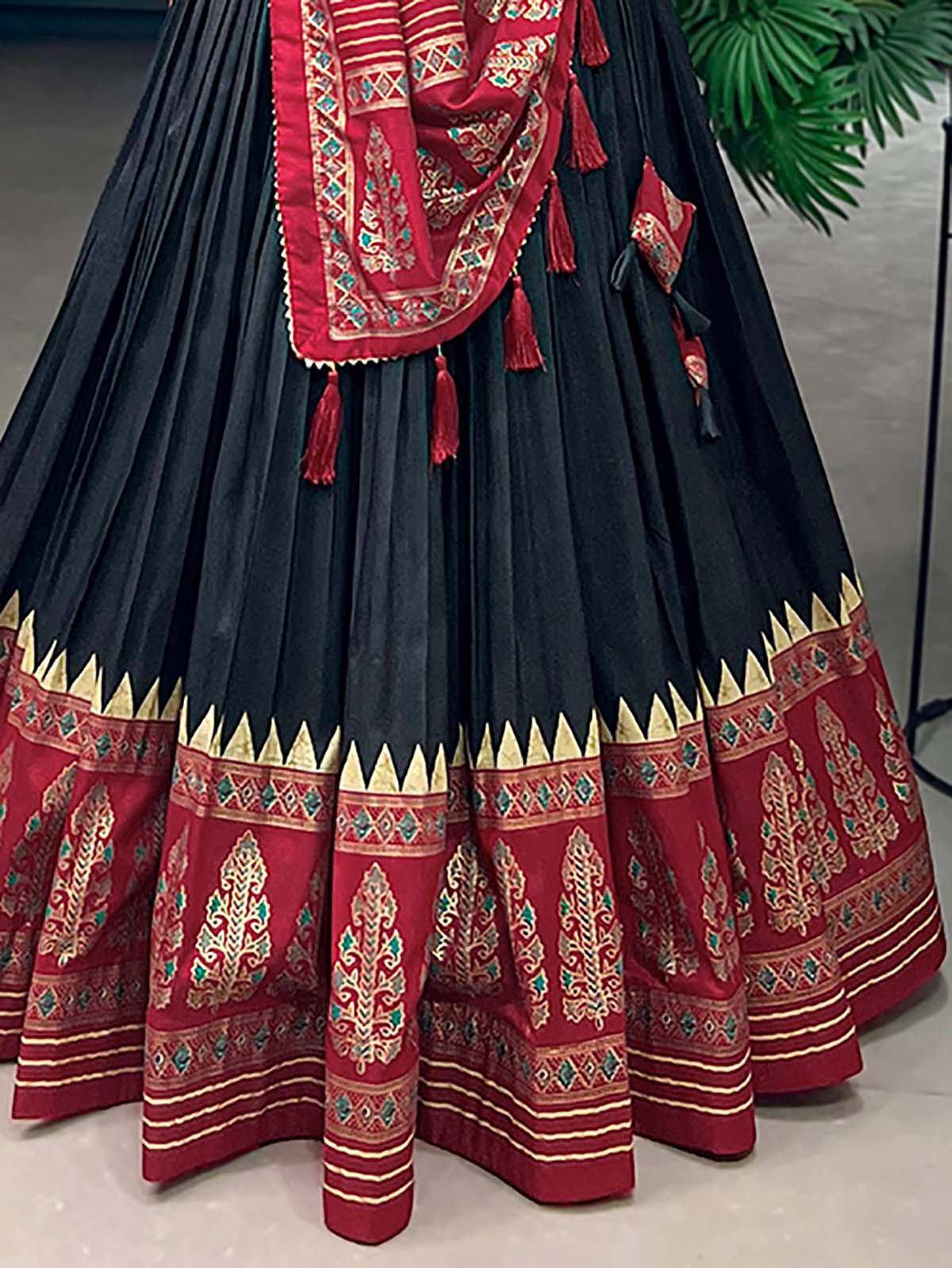 Black and red embroidered lehenga choli with gold detailing and tassels, ethnic Indian wear