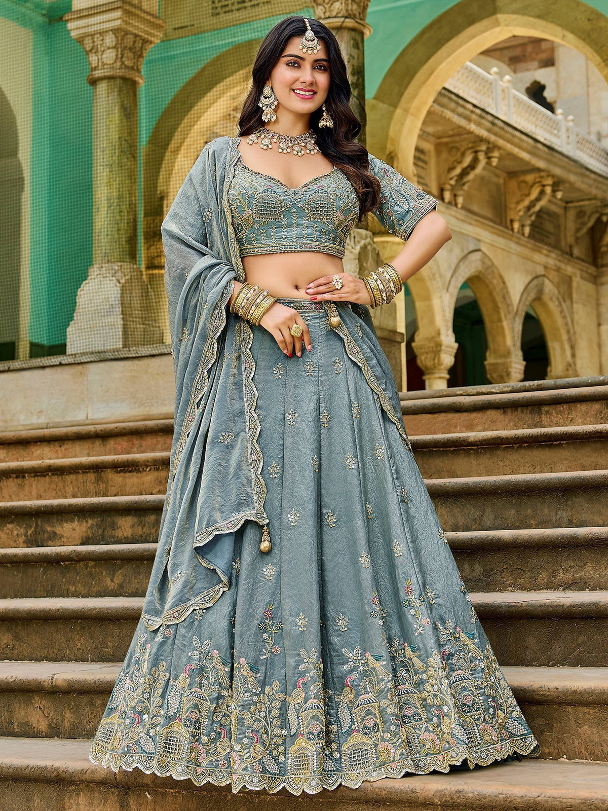 Blue embroidered lehenga choli with peacock motifs, perfect for Indian weddings and festive occasions