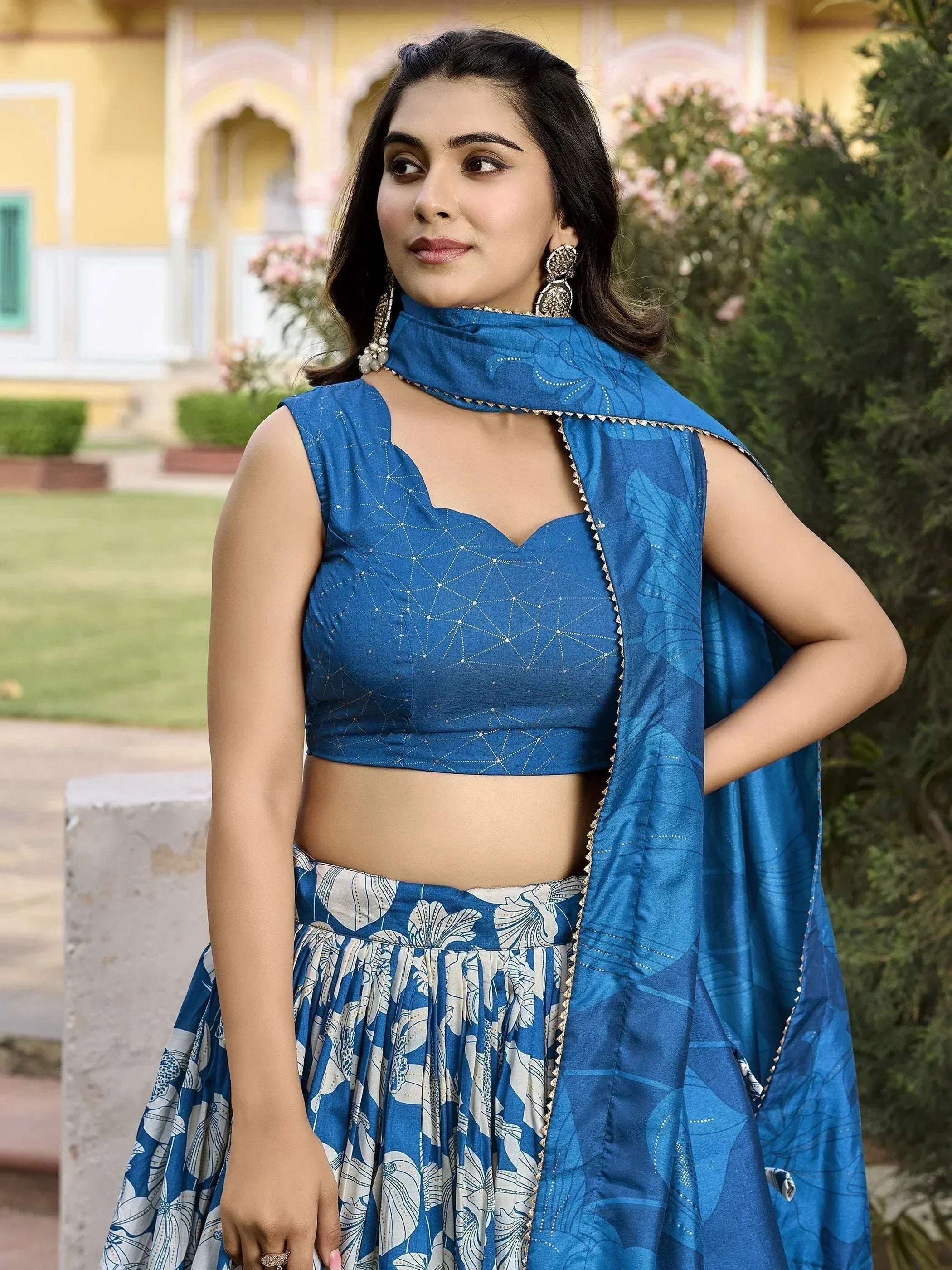 Blue ethnic lehenga choli with floral print and geometric embroidery, perfect for festive occasions.