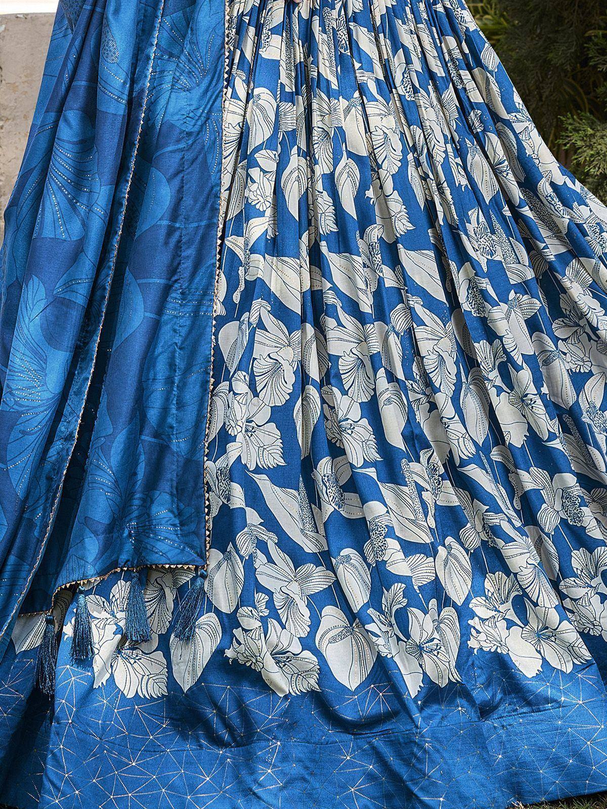 Blue floral printed lehenga choli with tassels and geometric border, ethnic Indian wear