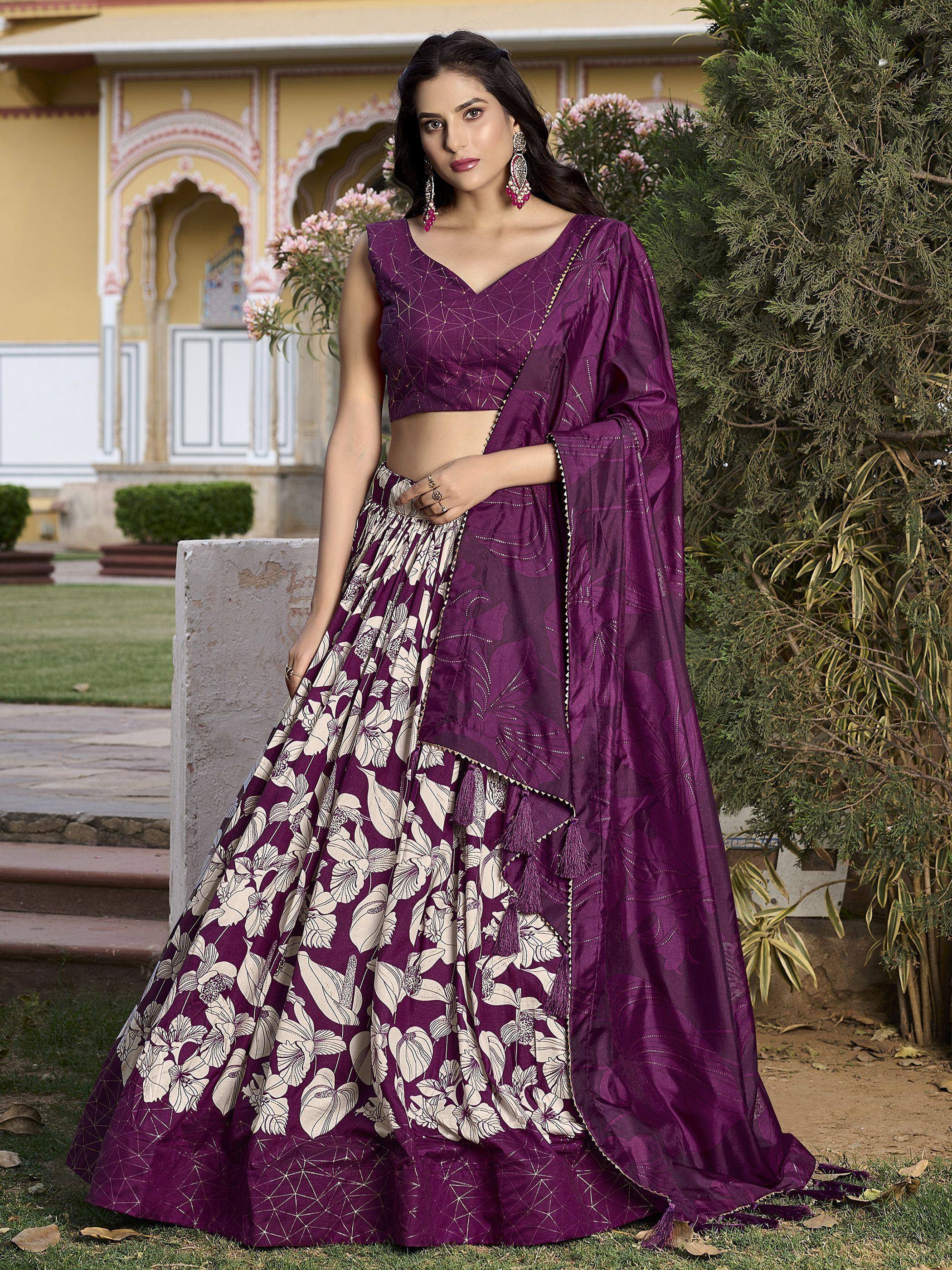Elegant ivory lehenga choli with peacock embroidery, floral motifs, and sheer dupatta for Indian weddings