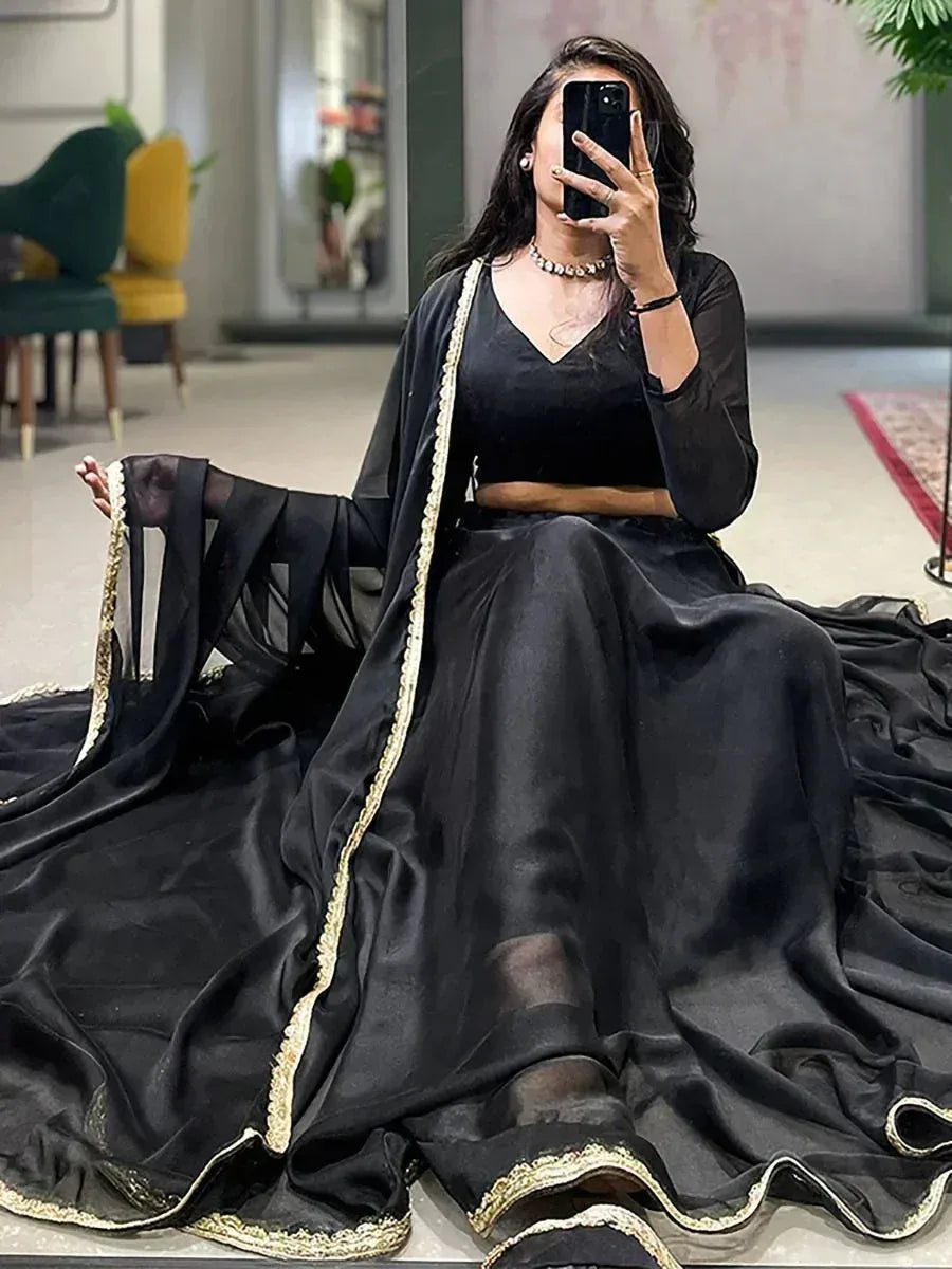 Black designer lehenga choli with gold trim, ethnic wear for women