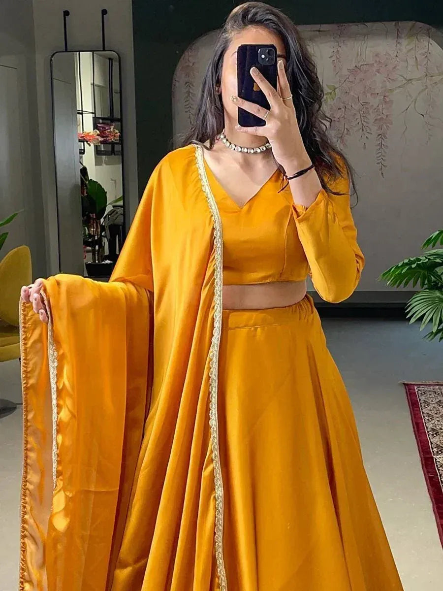 Mustard yellow lehenga choli with gold trim, perfect for Indian ethnic wear and festive occasions