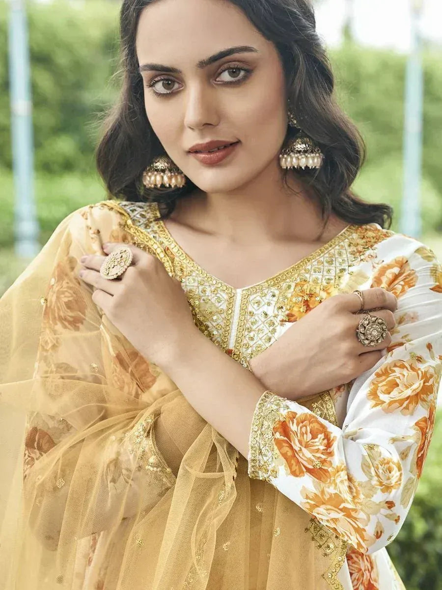 Elegant floral print salwar kameez with gold embroidery, perfect for Indian ethnic wear occasions.