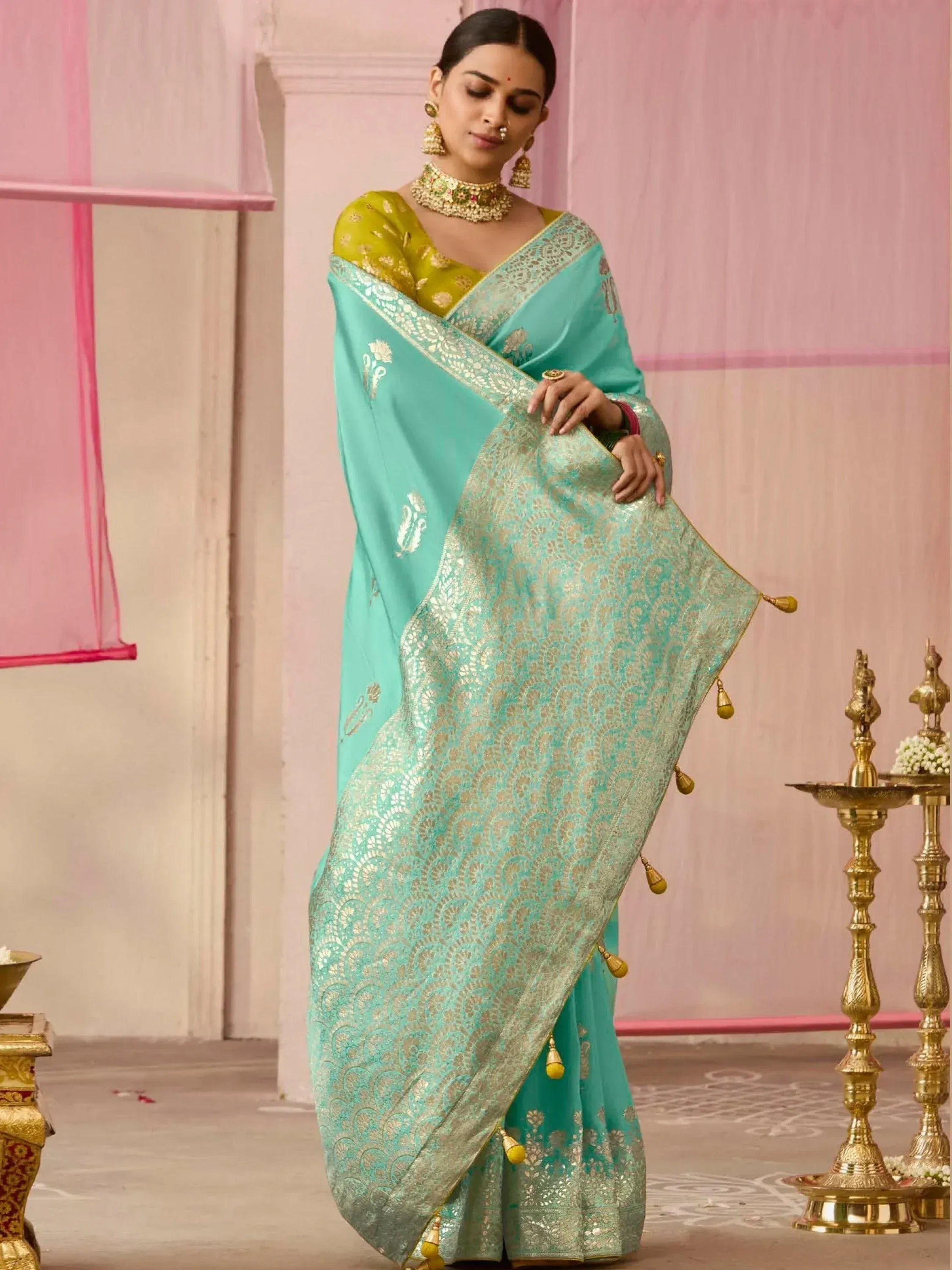 Turquoise designer saree with gold embroidery and yellow blouse, perfect for Indian ethnic occasions