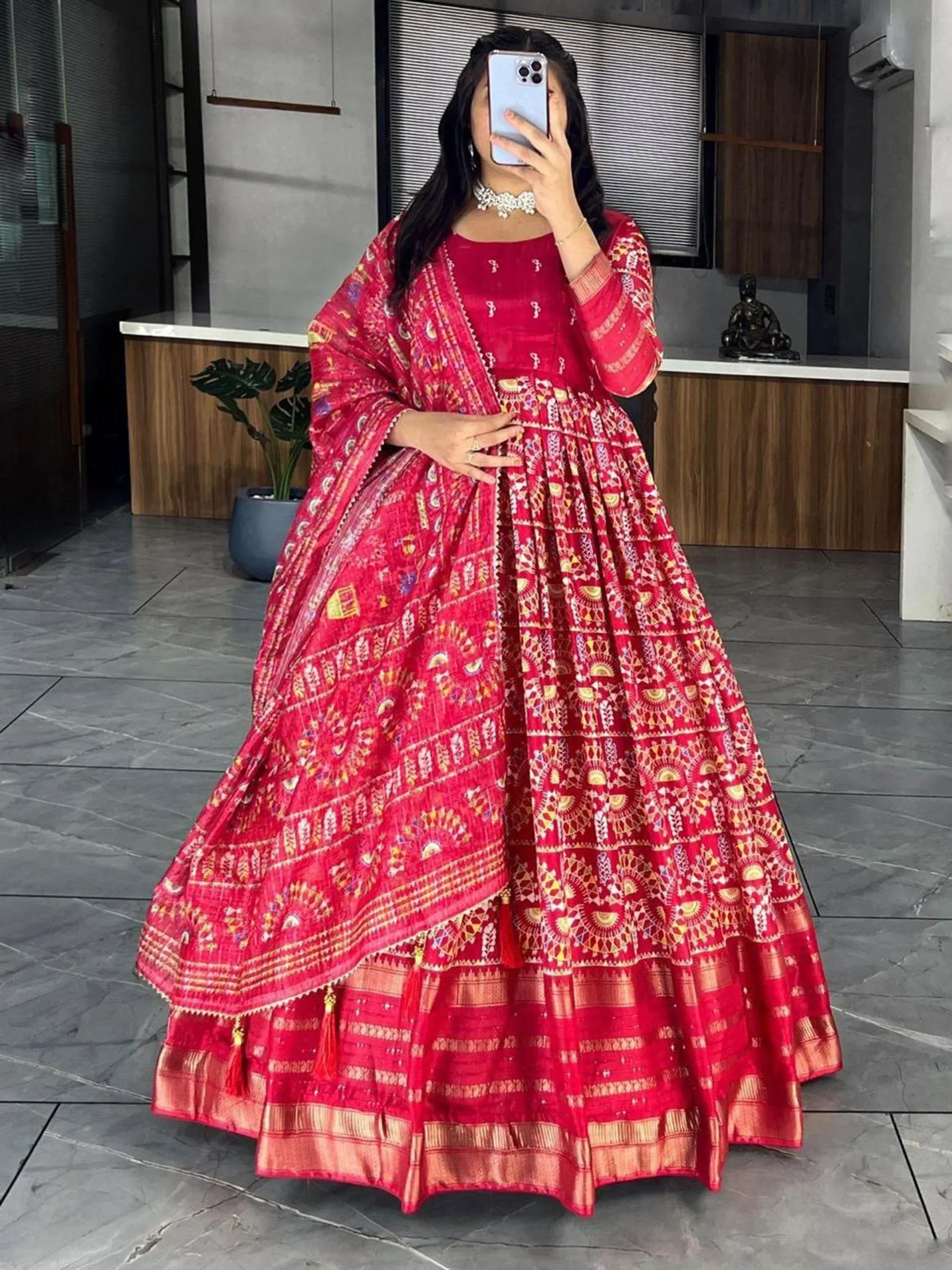 Red printed Indian ethnic lehenga choli with dupatta, perfect for weddings and festivals