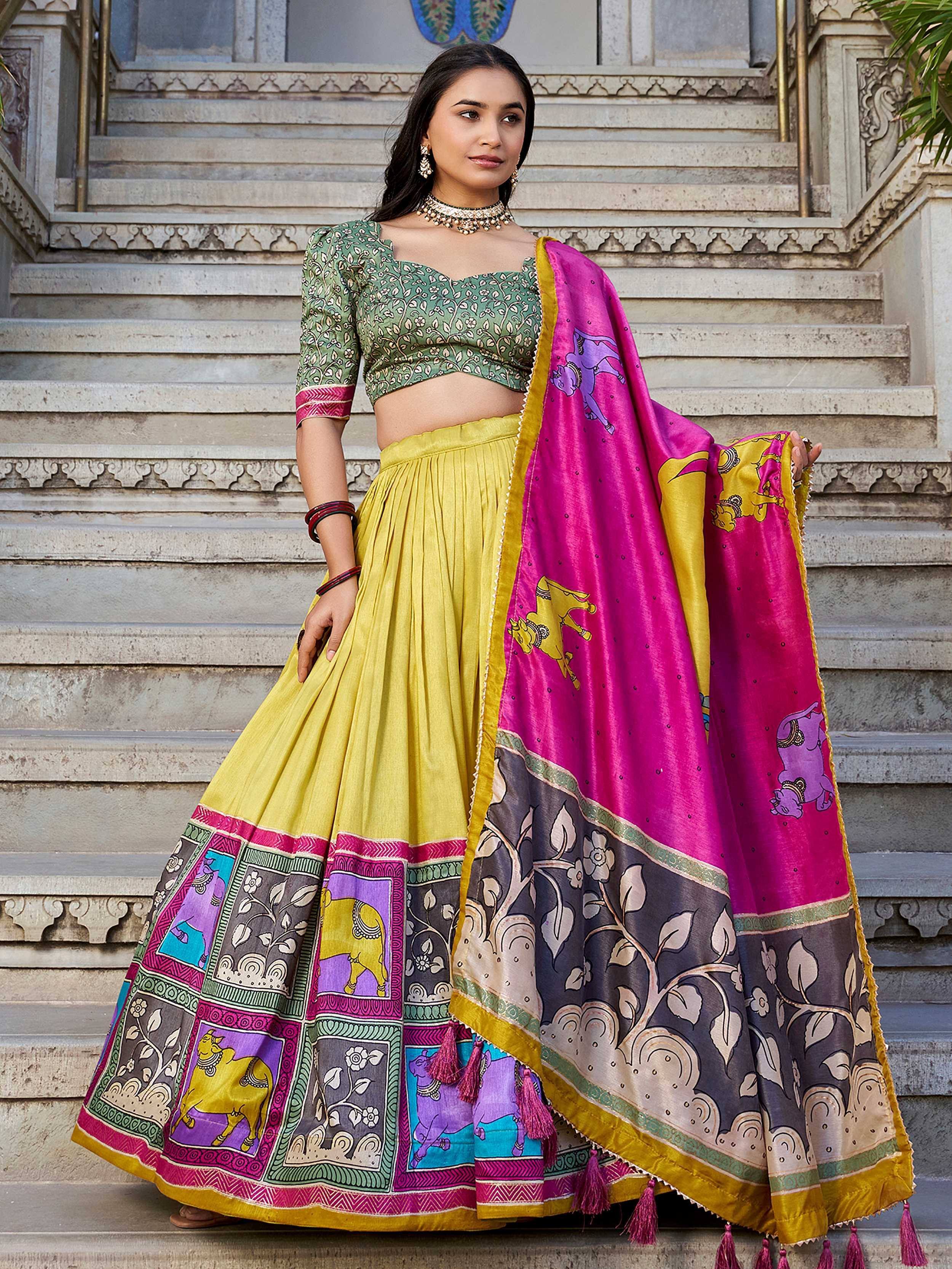 Woman in colorful Indian lehenga choli with elephant print, perfect for festive occasions and ethnic wear.