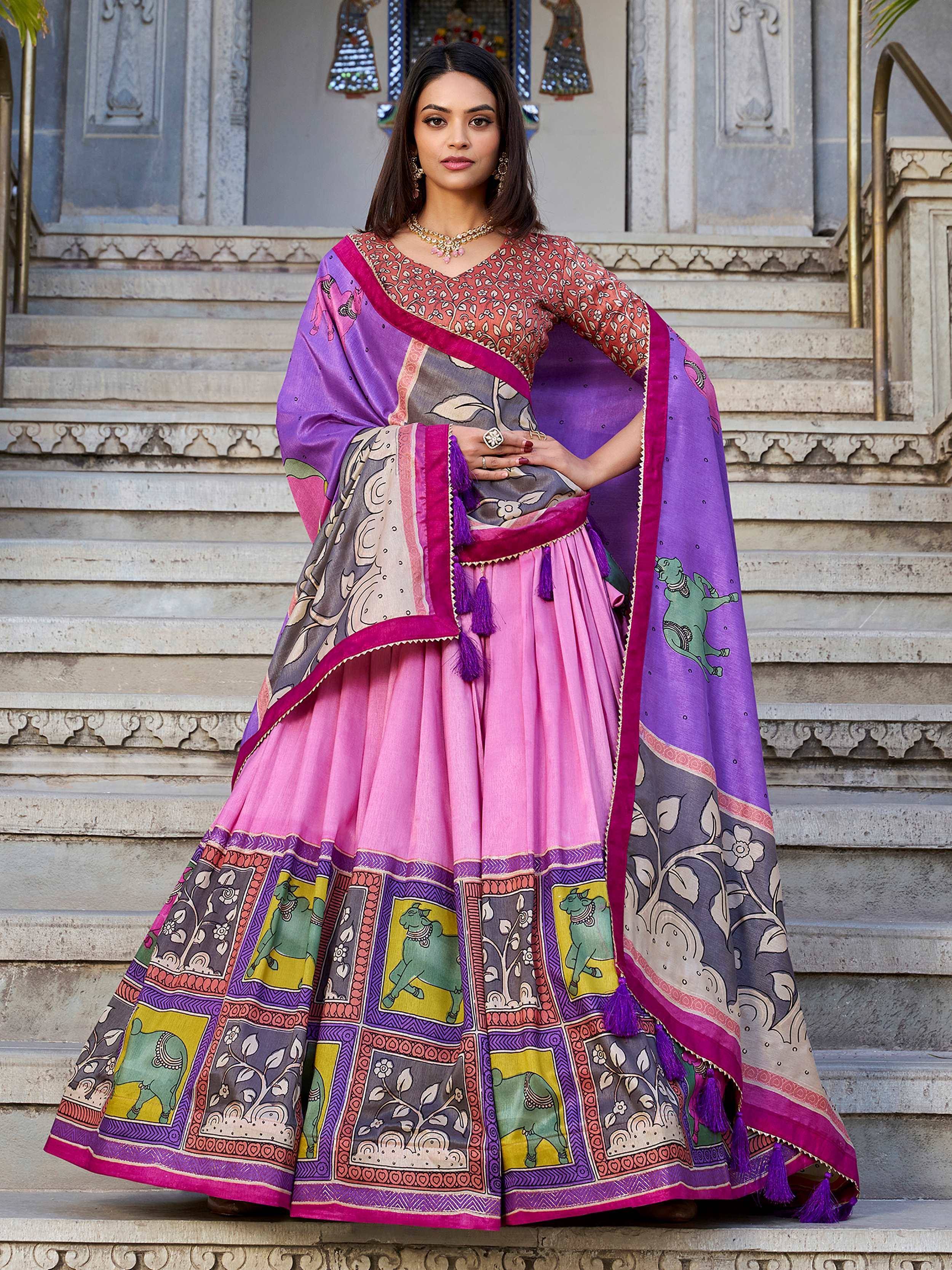 Pink and purple printed lehenga choli with elephant motifs, ideal for Indian ethnic wear occasions.