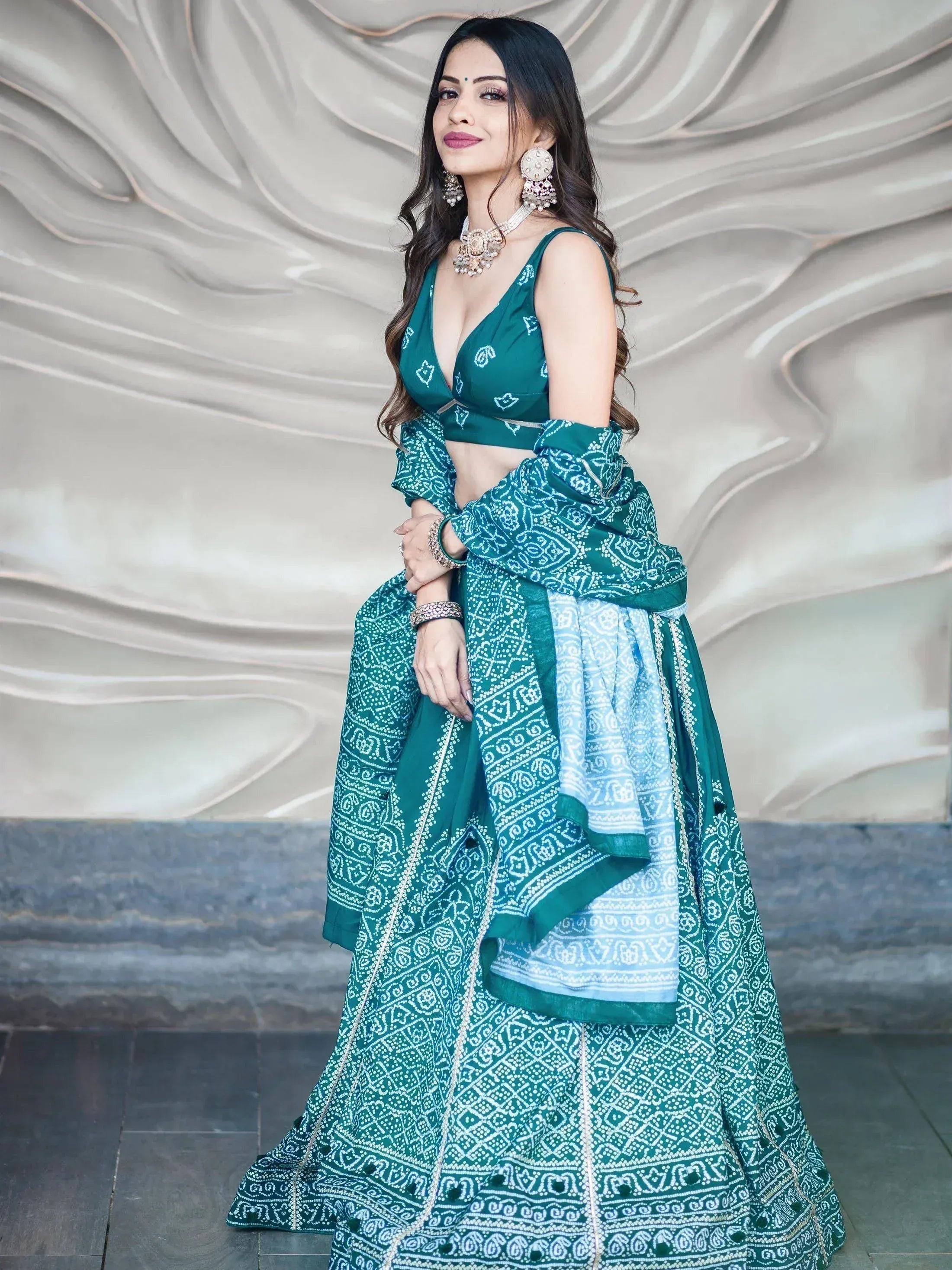 Green printed lehenga choli with white bandhani patterns, perfect for Indian ethnic wear events.