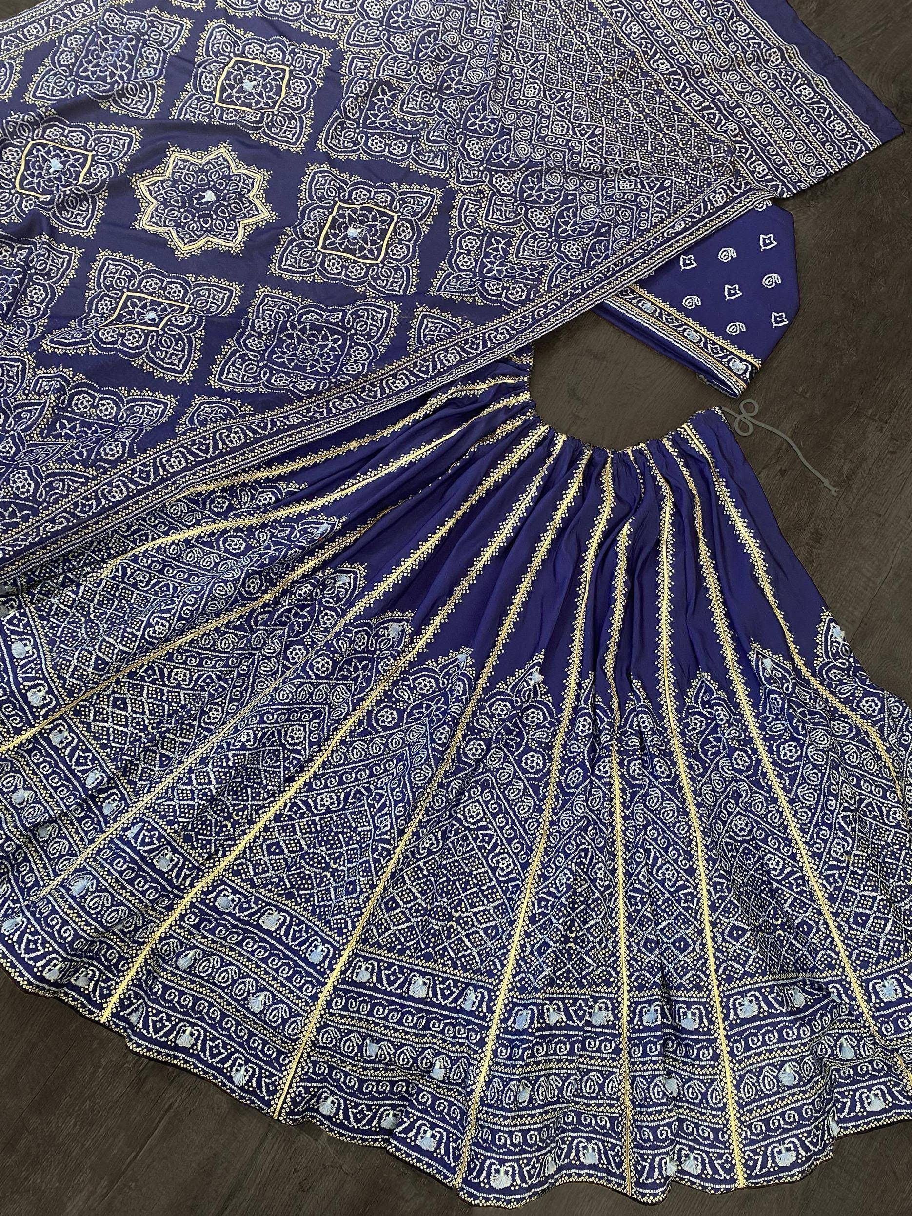 Navy blue ethnic lehenga choli with intricate white and gold block print patterns, perfect for Indian festive wear.