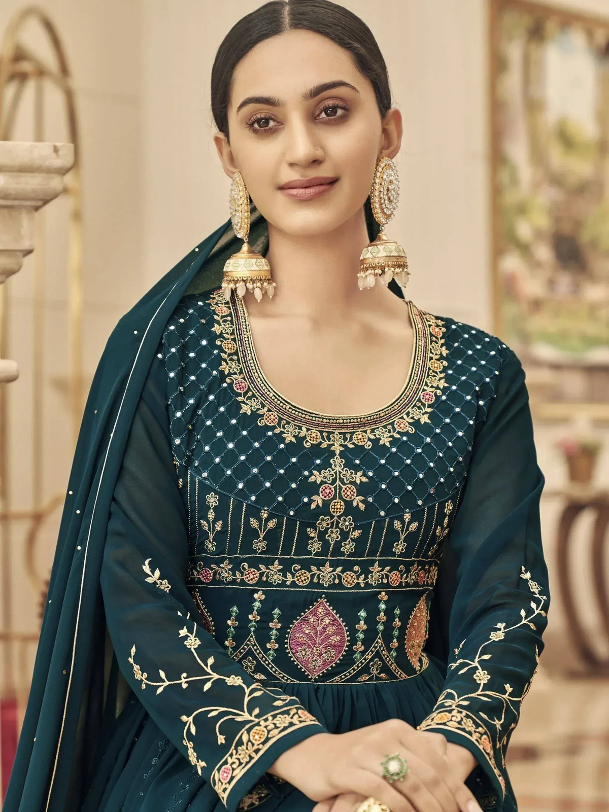 Elegant teal embroidered salwar kameez with gold floral work and matching dupatta, perfect for Indian ethnic occasions.