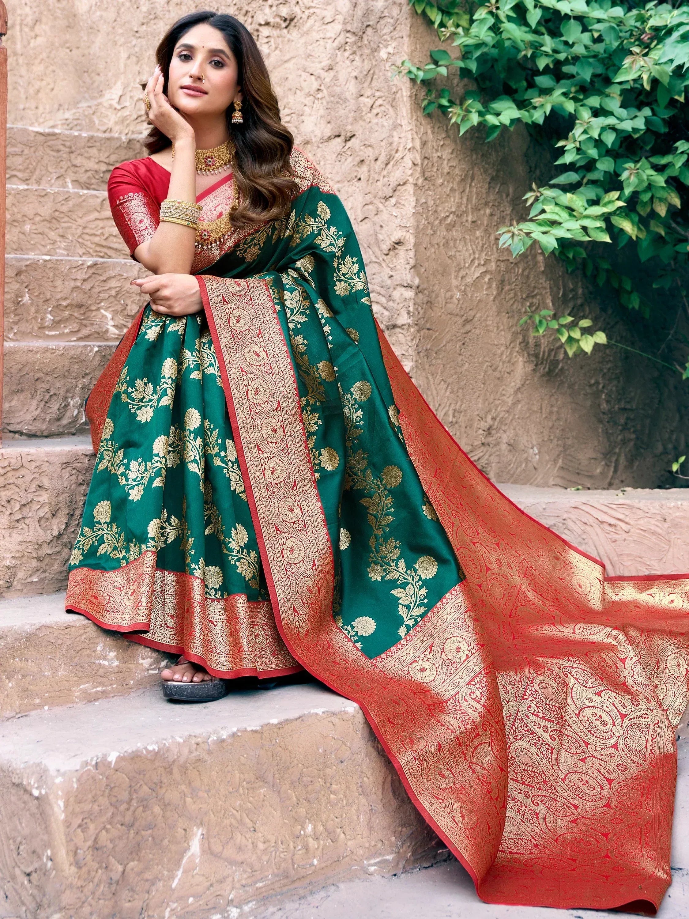 Green and red designer lehenga choli with gold floral embroidery, perfect for Indian ethnic wear occasions.