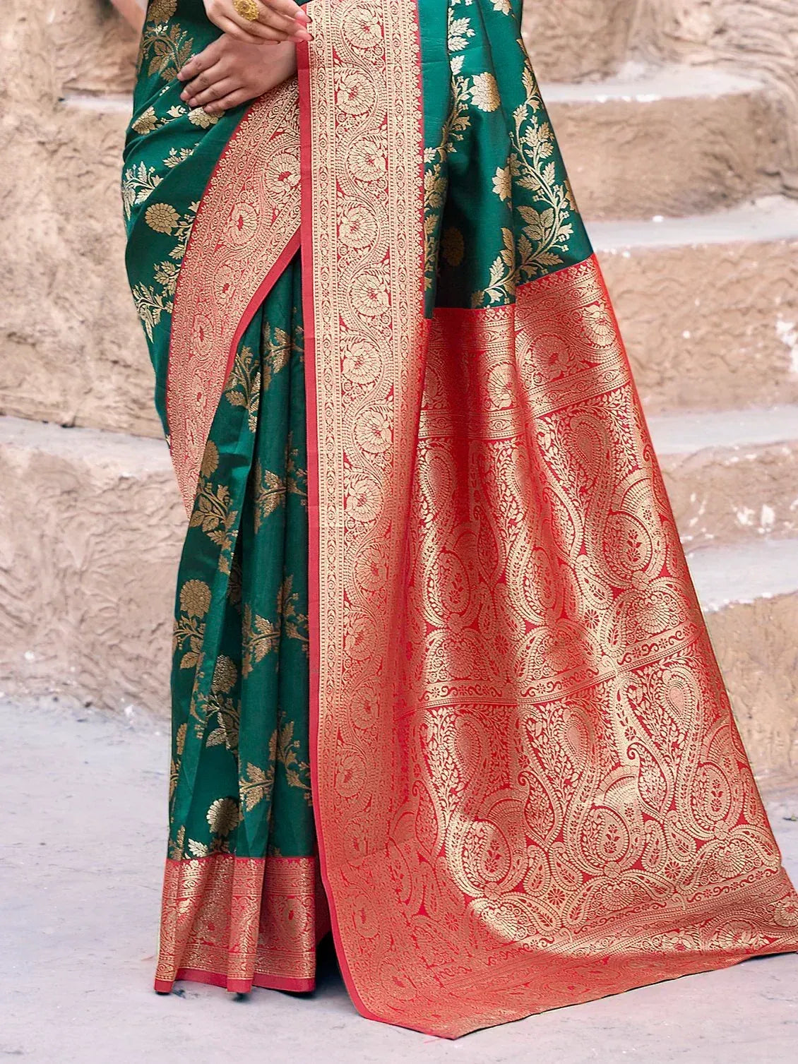 Green and red designer saree with gold floral and paisley motifs, perfect for ethnic occasions