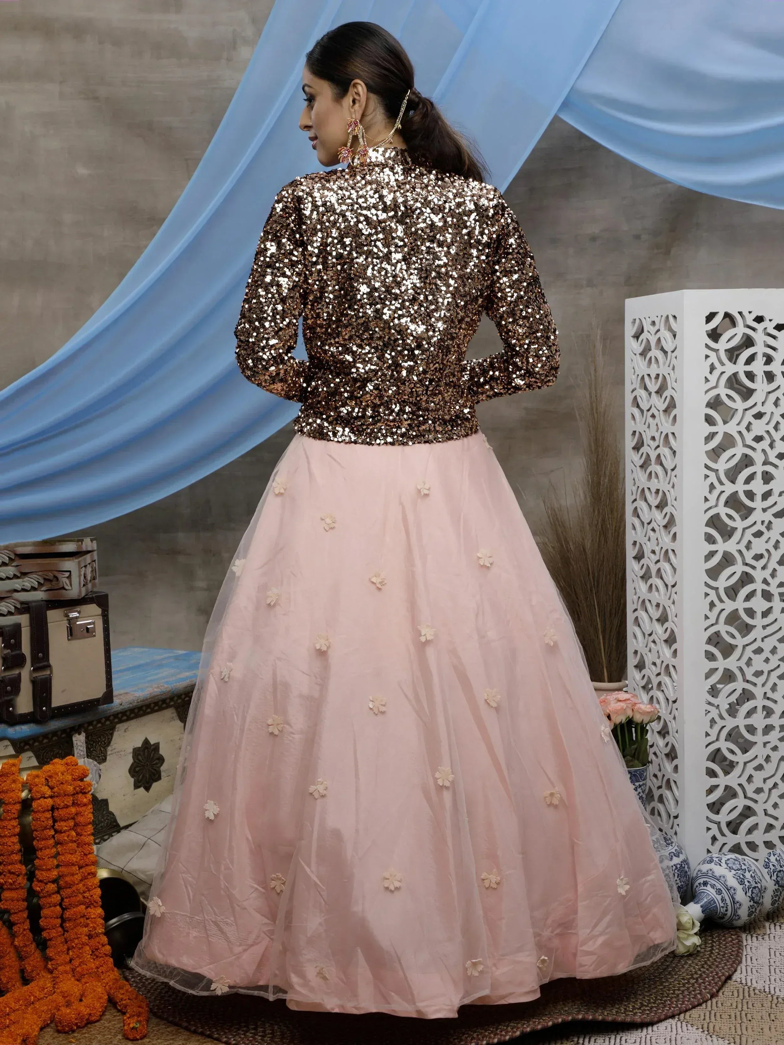 Woman in sequin top and floral pink lehenga, Indian ethnic wear for festive occasions