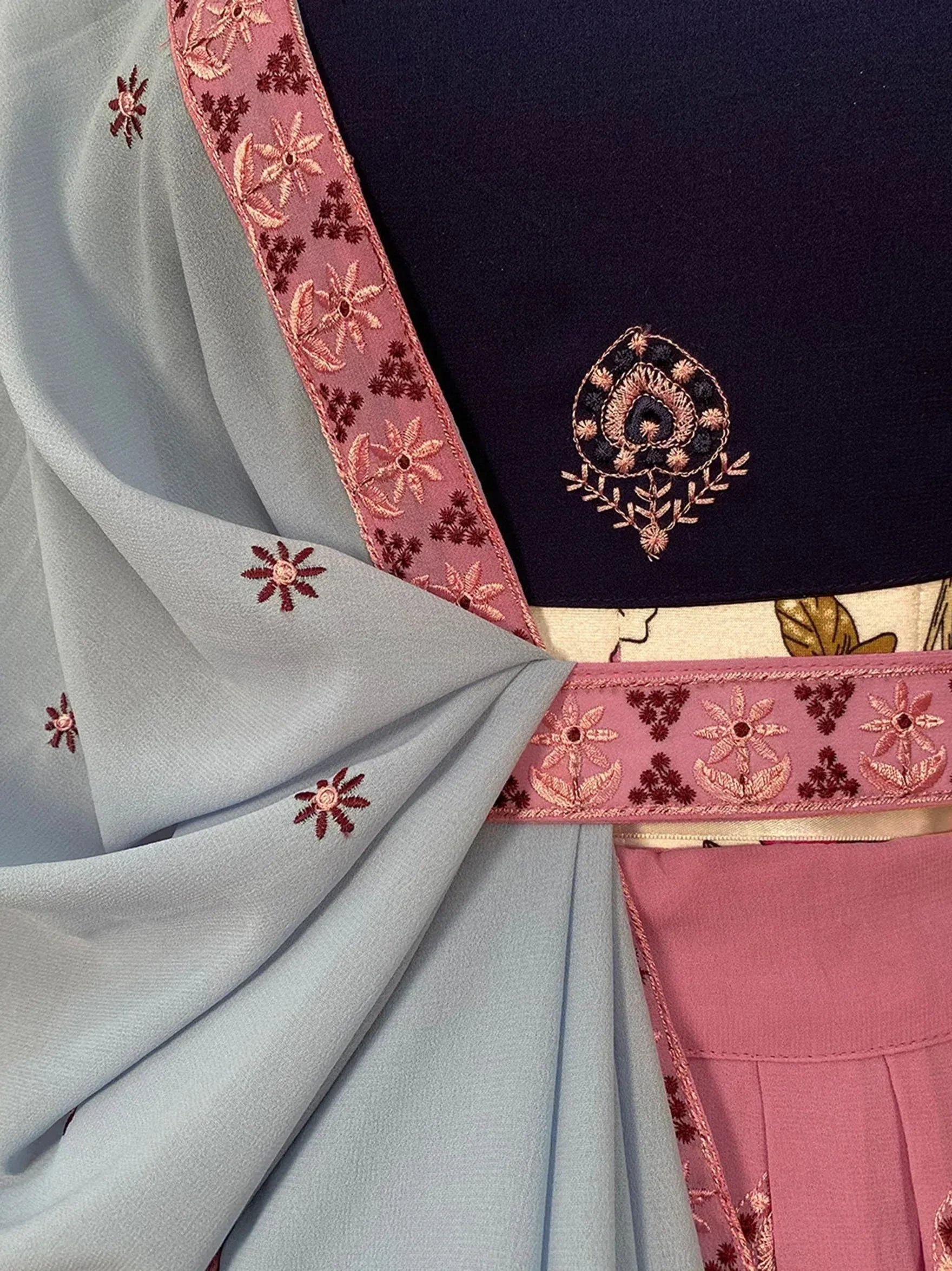 Blue and pink embroidered lehenga choli with floral detailing and matching dupatta