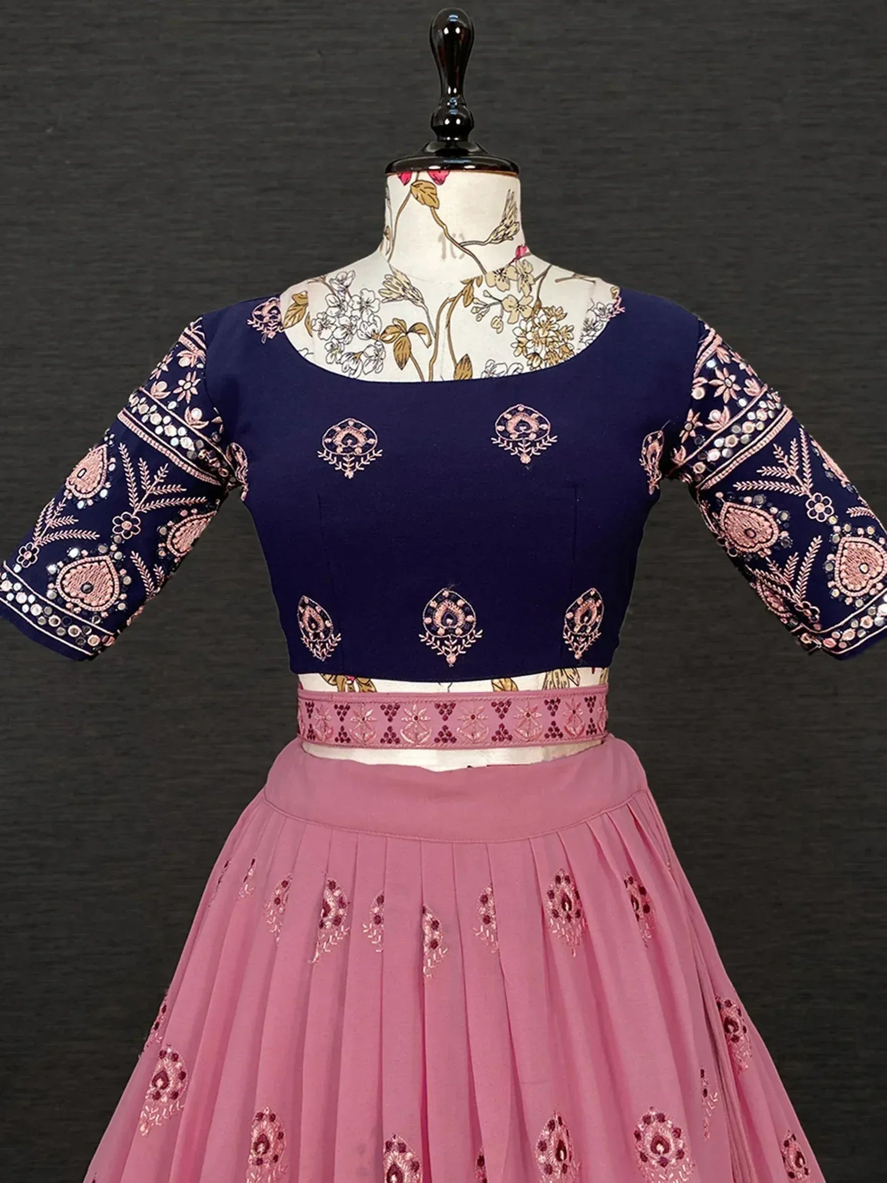 Navy blue and pink embroidered lehenga choli with mirror work, perfect for Indian ethnic wear occasions.