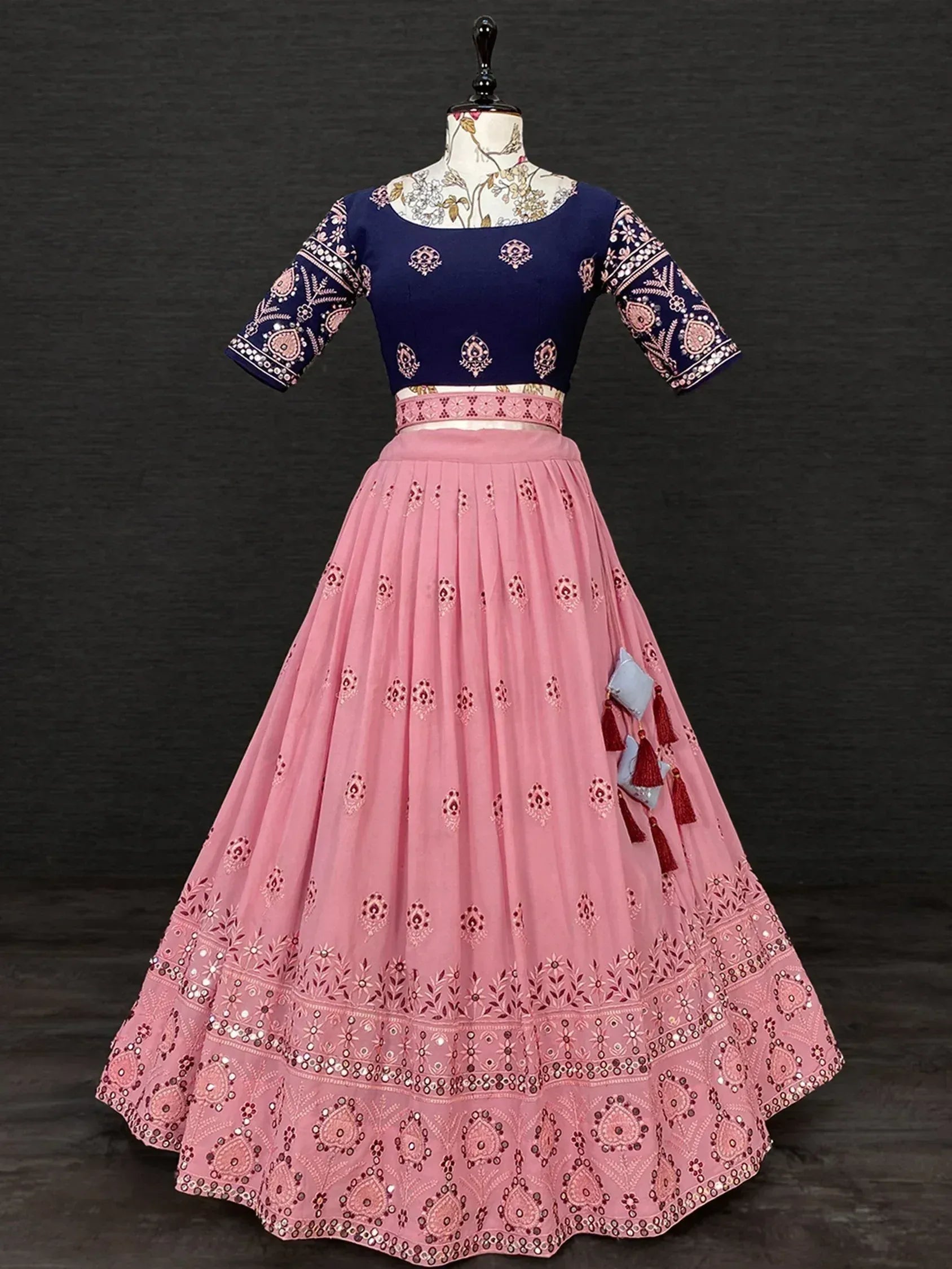 Pink and navy blue embroidered lehenga choli with tassels, ideal for Indian ethnic wear occasions
