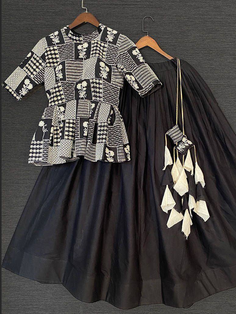 Black and white embroidered ethnic gown with patchwork top and pleated skirt, perfect for Indian occasions