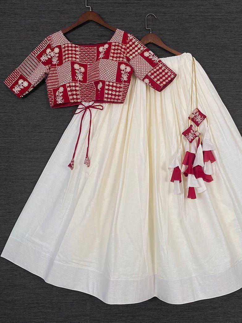 Red and white embroidered lehenga choli with patchwork blouse and tassel dupatta, ethnic Indian wear