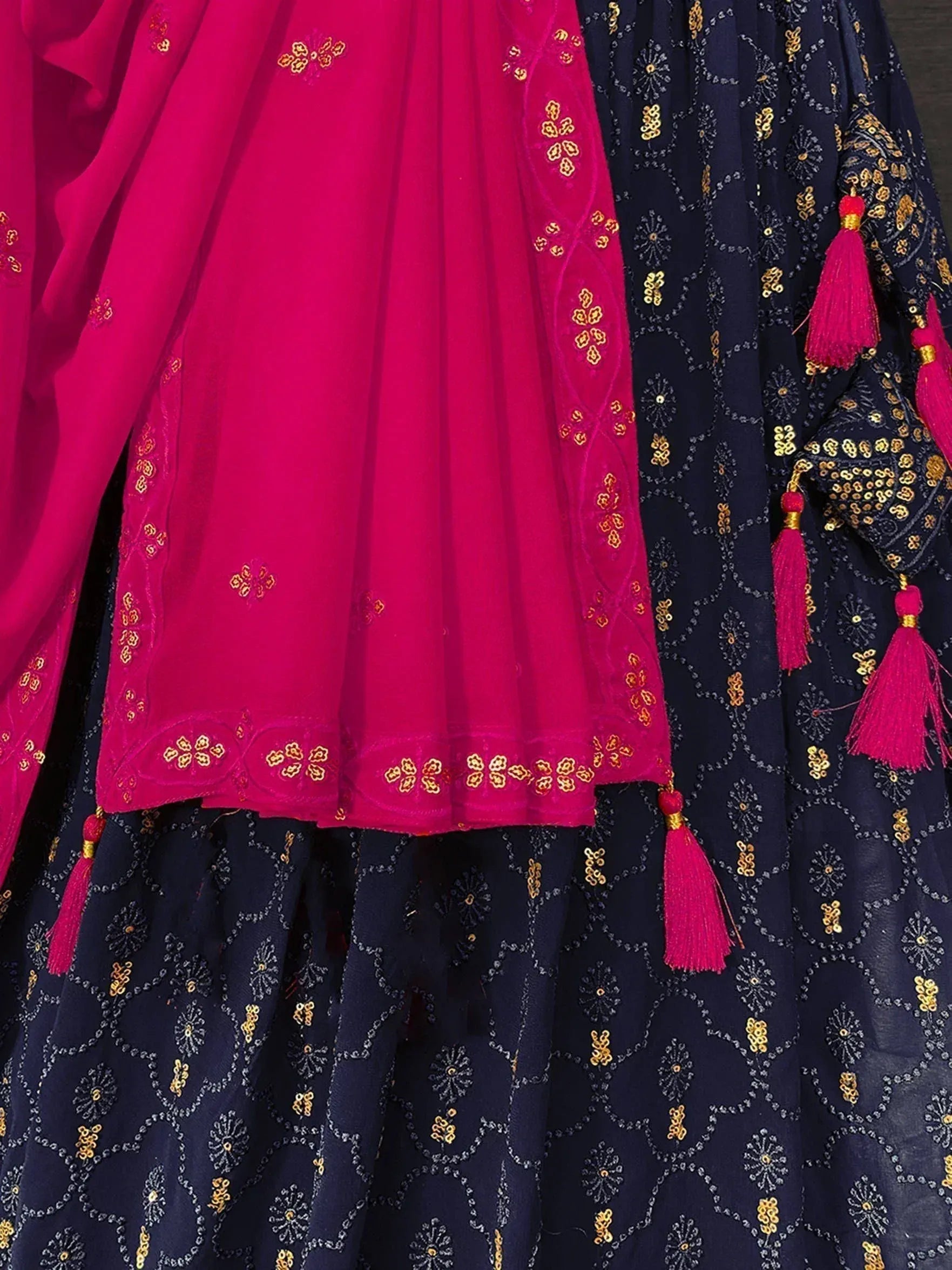 Navy blue and fuchsia Indian ethnic lehenga with gold embroidery and tassels