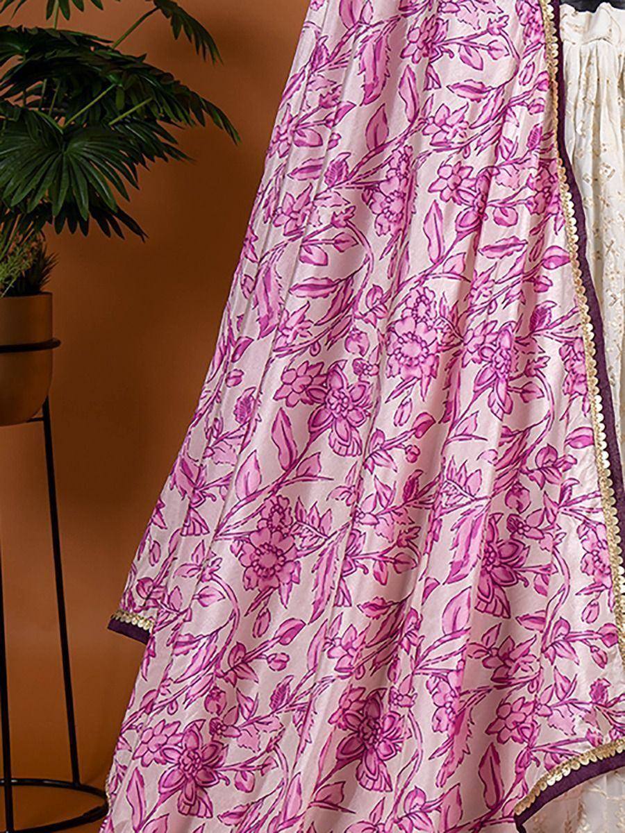 Pink floral printed ethnic gown with gold trim, ideal for Indian occasions and festive wear.