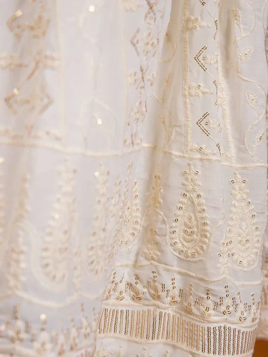 White ethnic gown with gold embroidery and sequin detailing, perfect for Indian weddings or festive occasions.