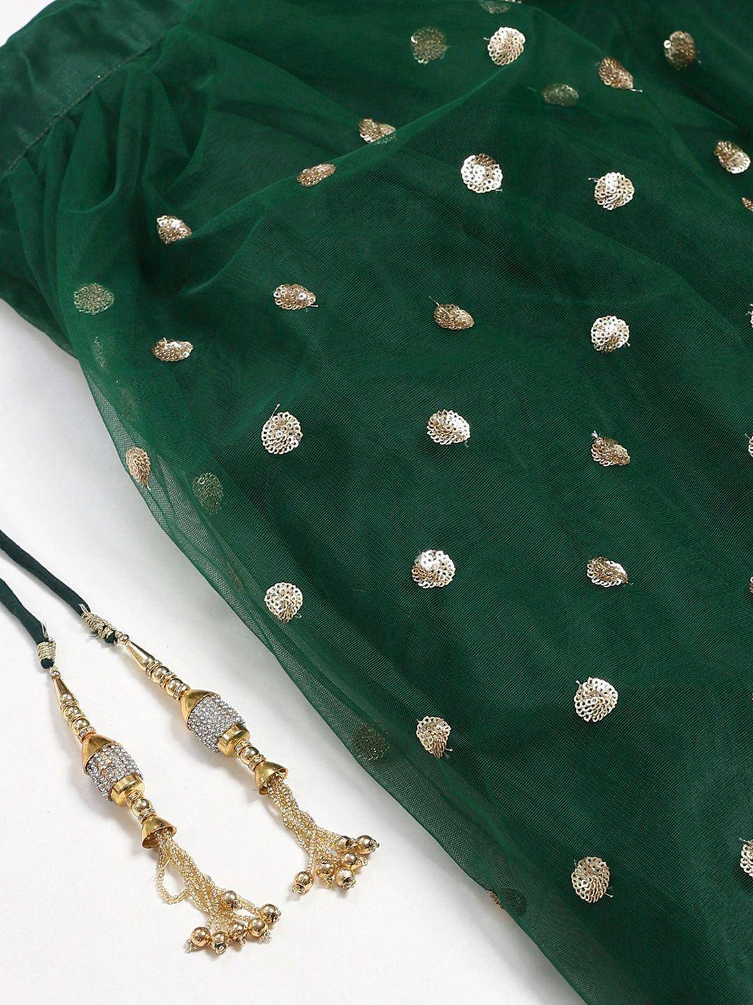 Emerald green ethnic saree with gold floral embroidery and matching tassels