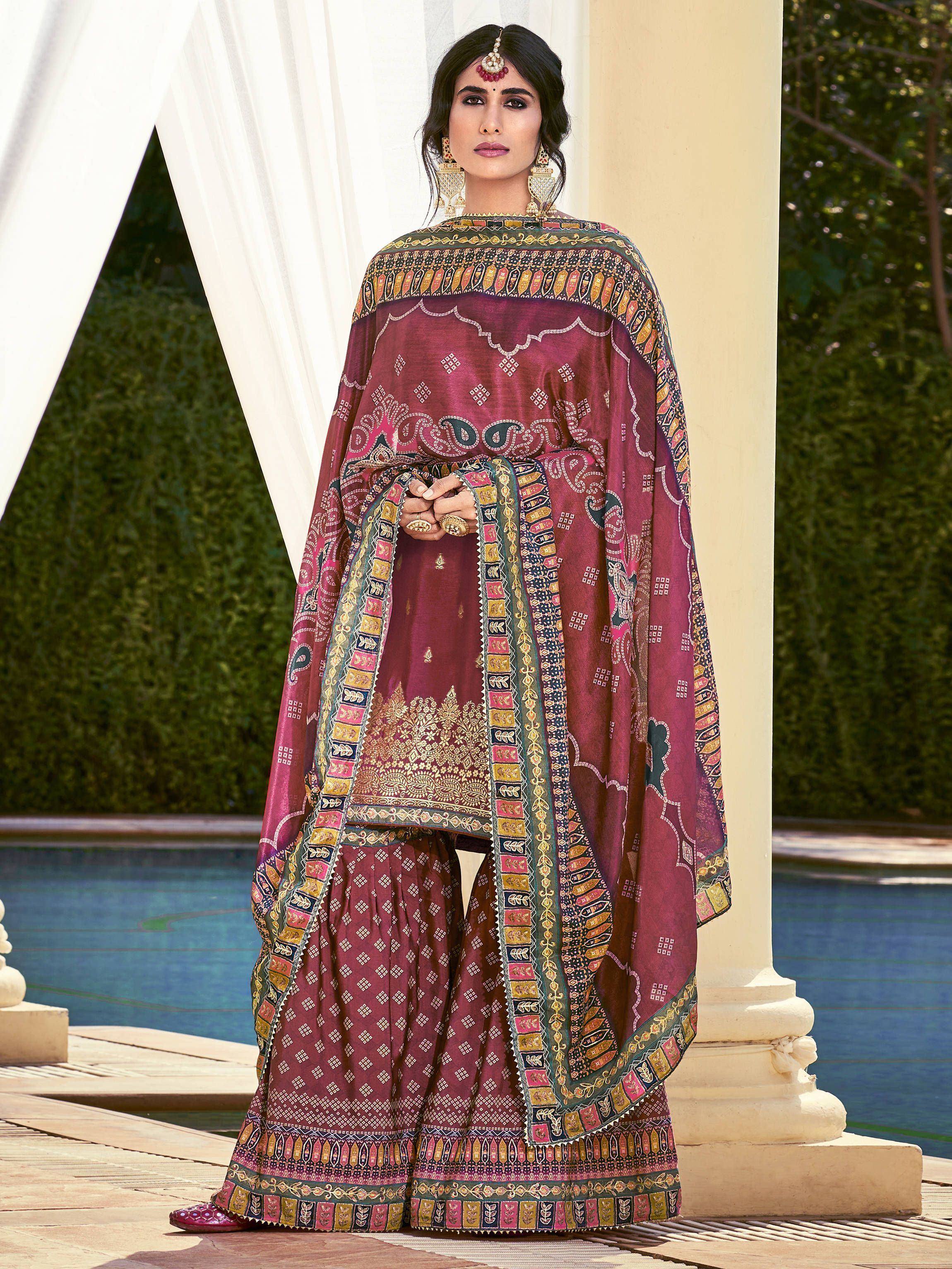 Maroon printed salwar kameez with ethnic embroidery, perfect for Indian festive occasions