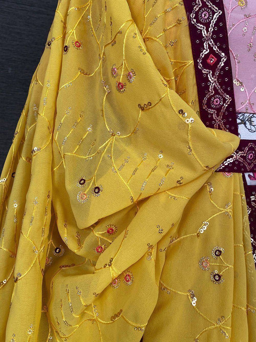 Yellow ethnic gown with floral embroidery and sequin detailing, perfect for Indian festive wear