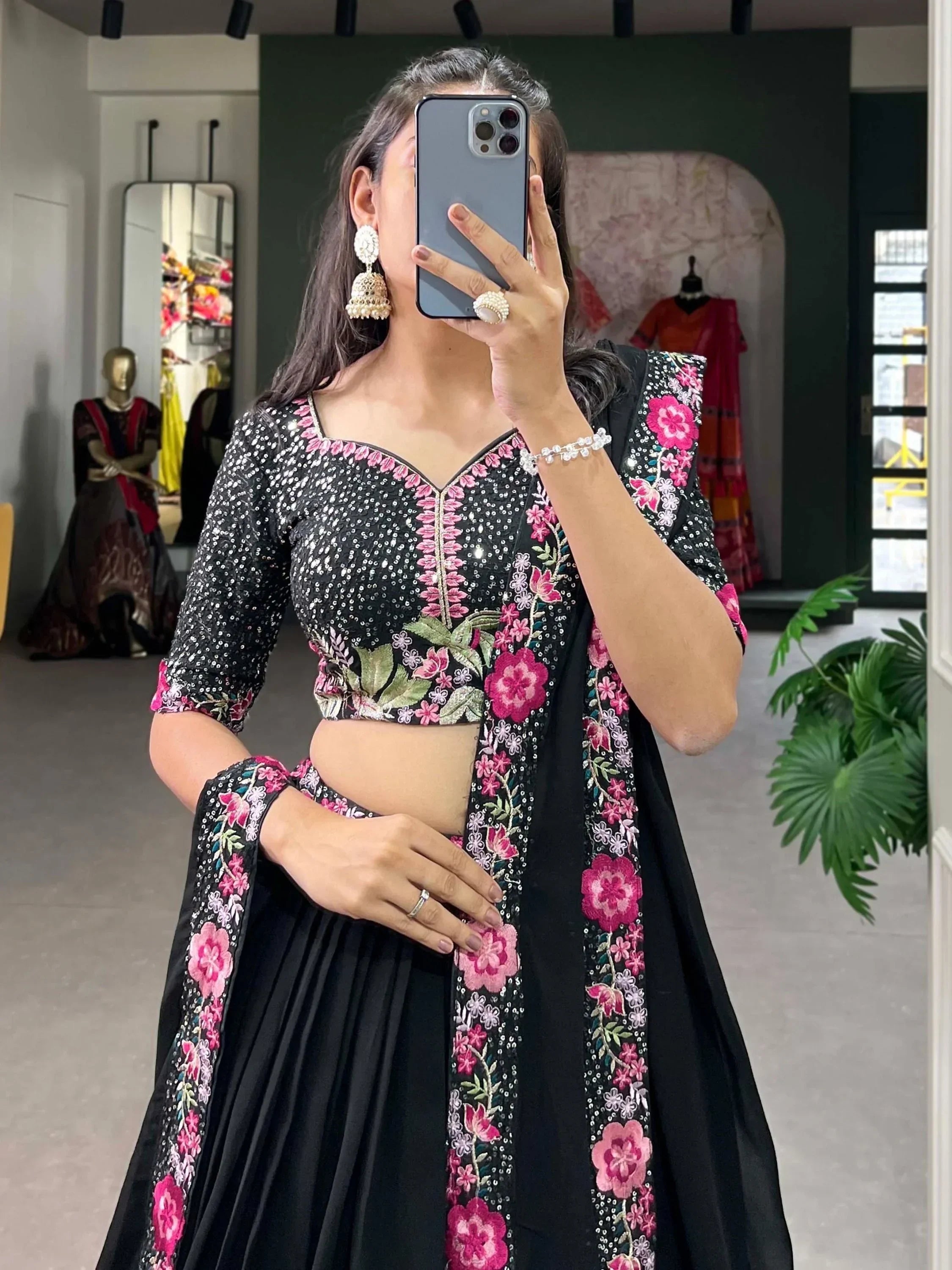 Black lehenga choli with pink floral embroidery and sequins, perfect for Indian ethnic wear occasions
