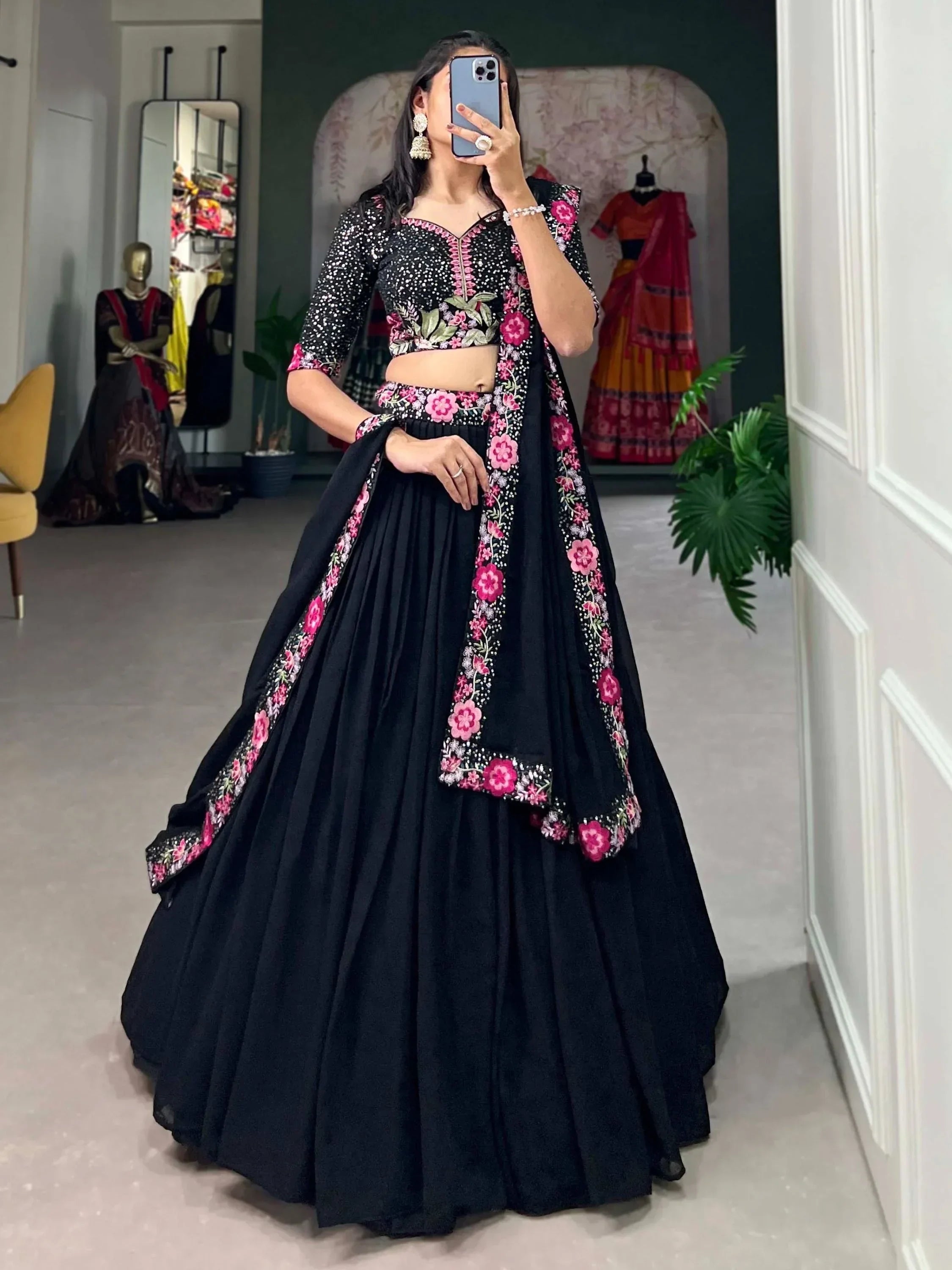 Black lehenga choli with pink floral embroidery, perfect for Indian ethnic wear occasions