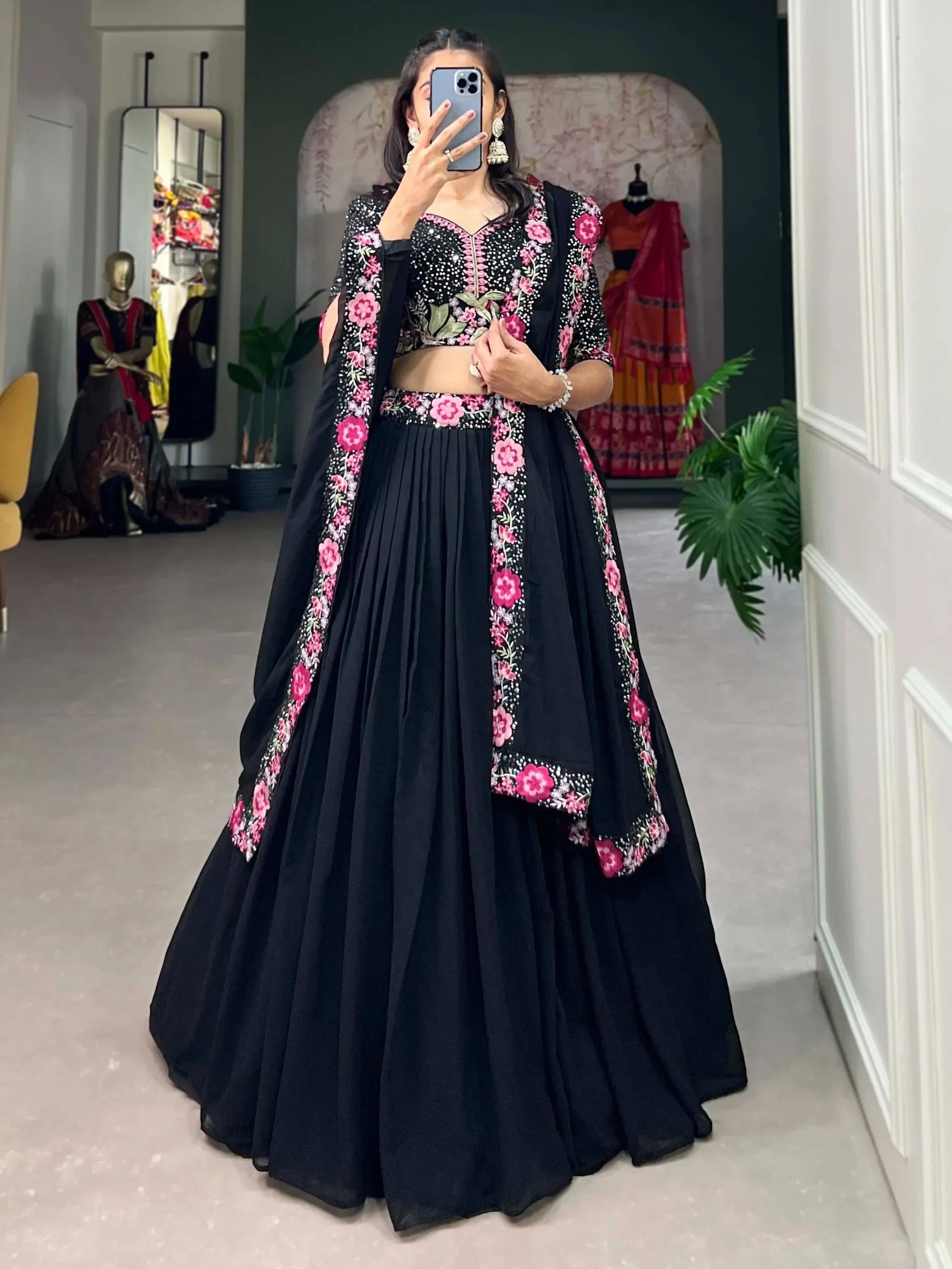 Black lehenga choli with pink floral embroidery, perfect for Indian ethnic wear events