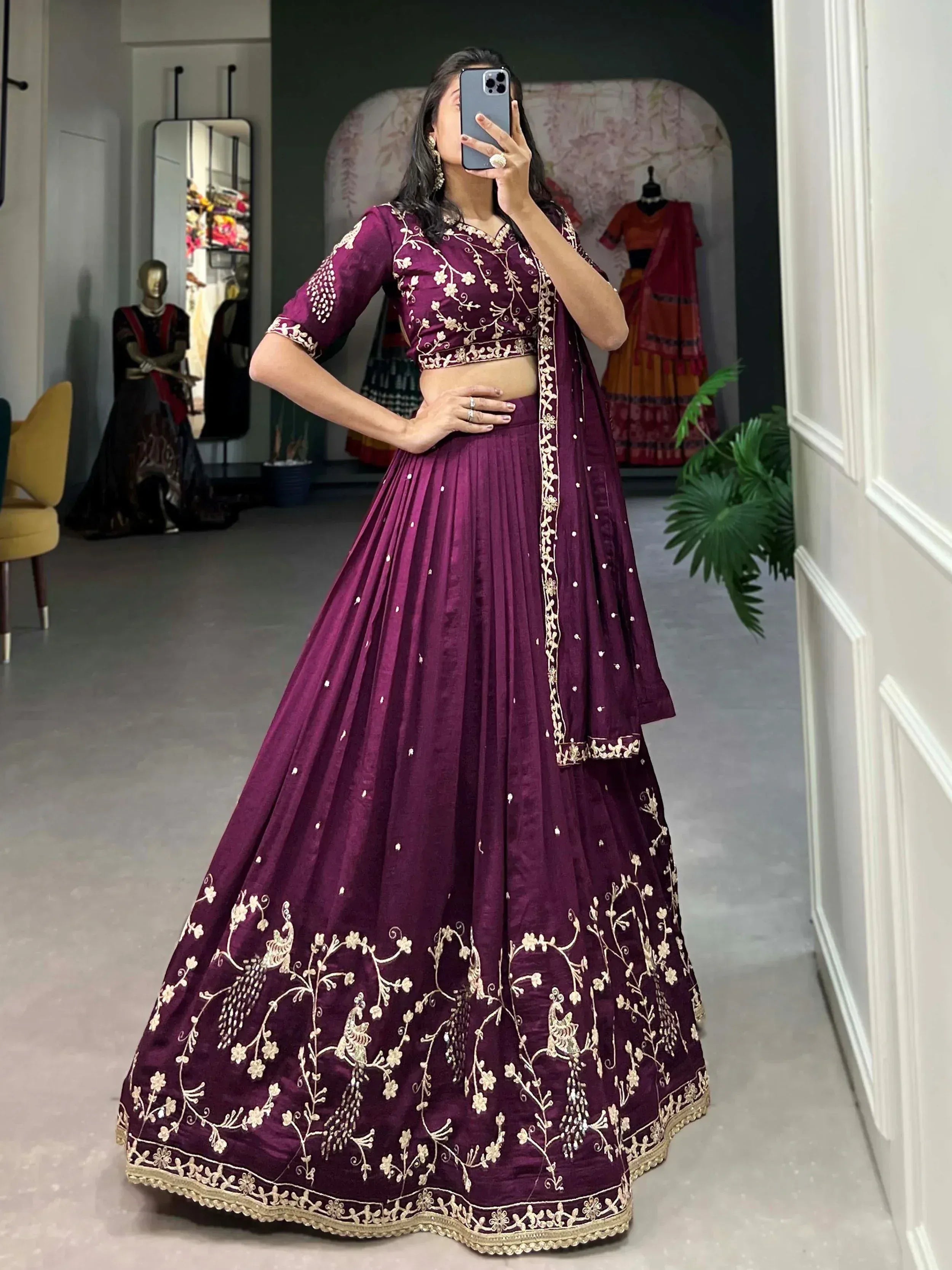 Purple embroidered lehenga choli with gold floral and peacock motifs, perfect for Indian ethnic wear
