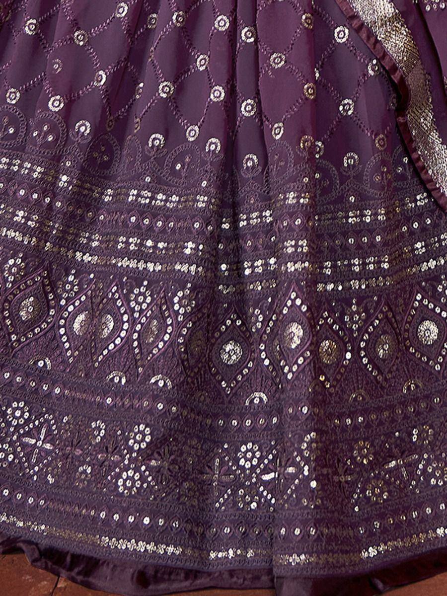 Purple ethnic lehenga with intricate gold and silver embroidery and mirror work detailing