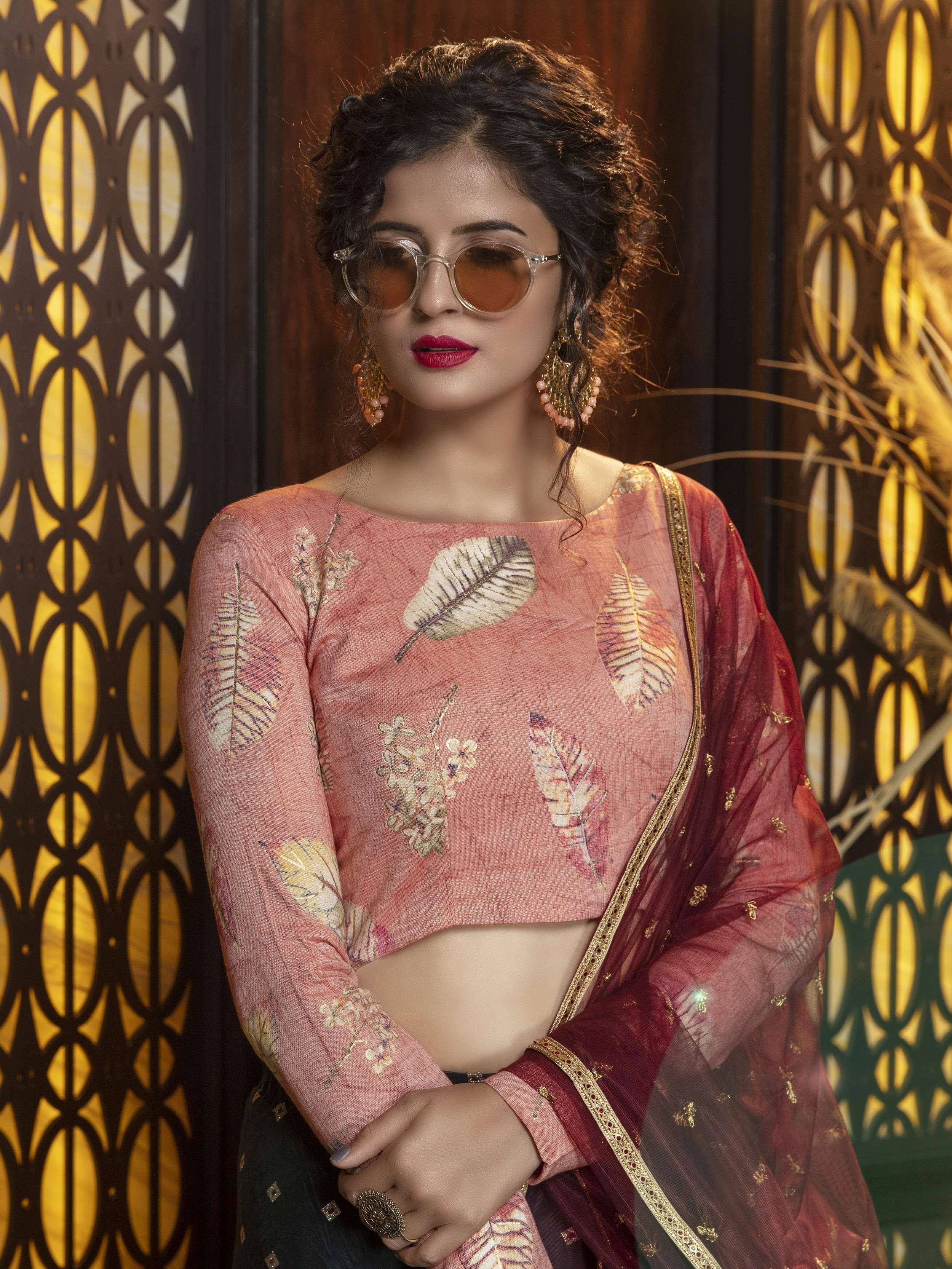 Woman in pink leaf-print crop top with maroon dupatta, ethnic Indian wear