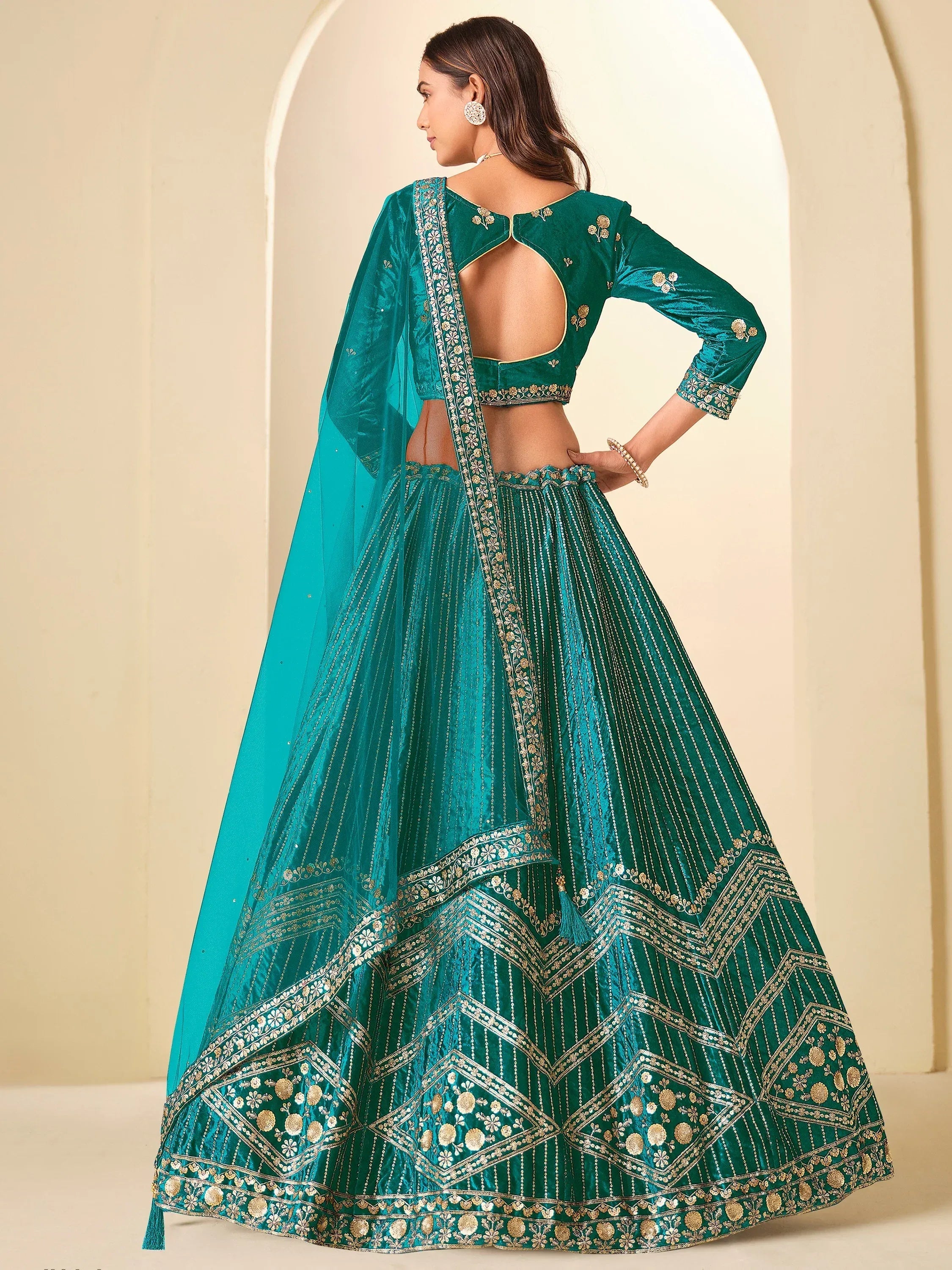 Graceful Teal Blue Embroidered Velvet Reception Wear Lehenga Choli