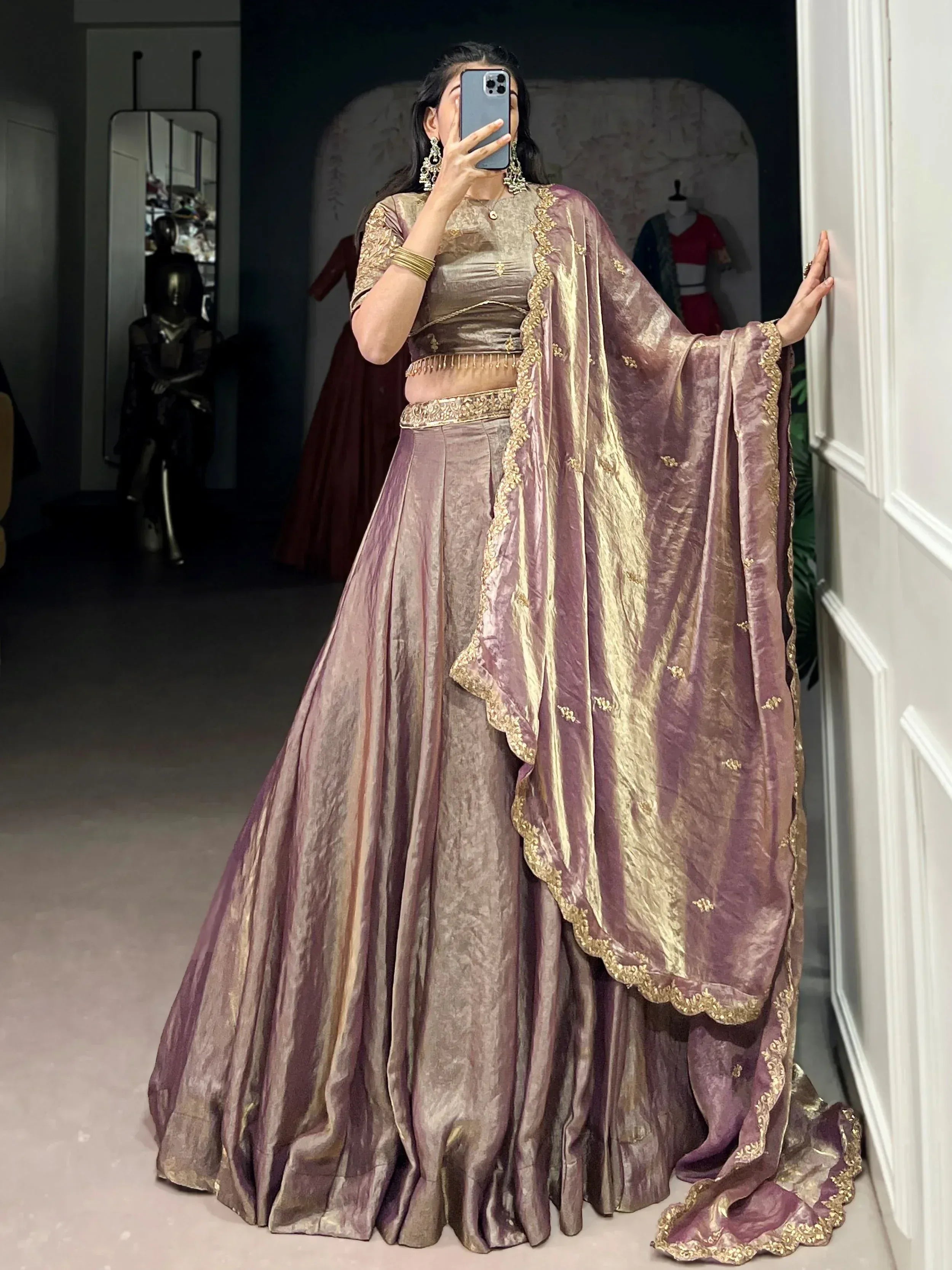 Elegant mauve and gold lehenga choli with intricate embroidery, perfect for Indian ethnic occasions
