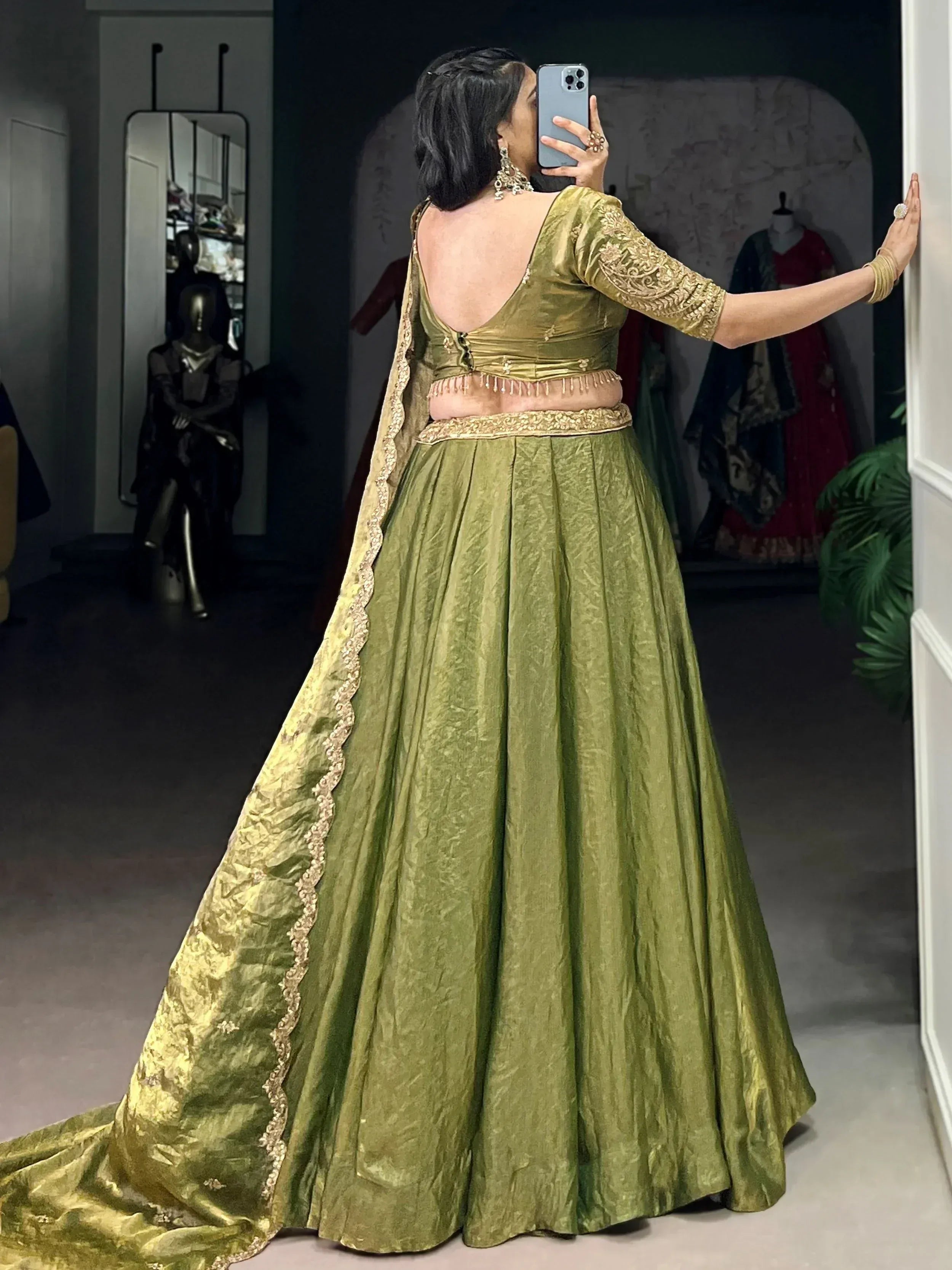 Olive green designer lehenga choli with gold embroidery, back view, ethnic wear for women