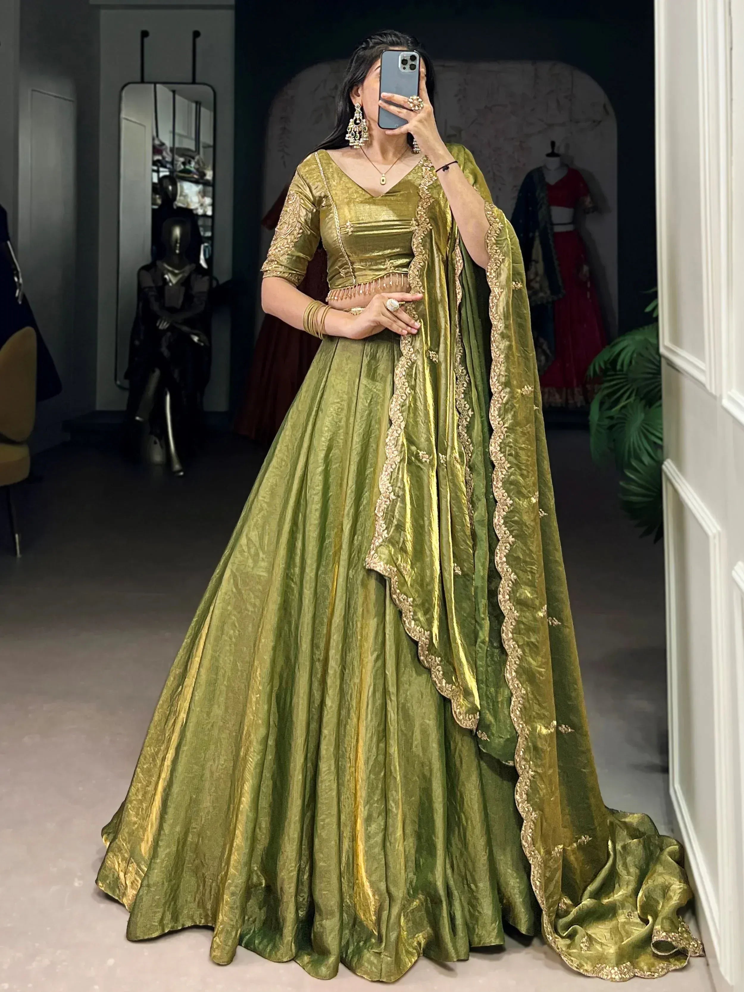 Olive green designer lehenga choli with gold embroidery, perfect for weddings and festive occasions.
