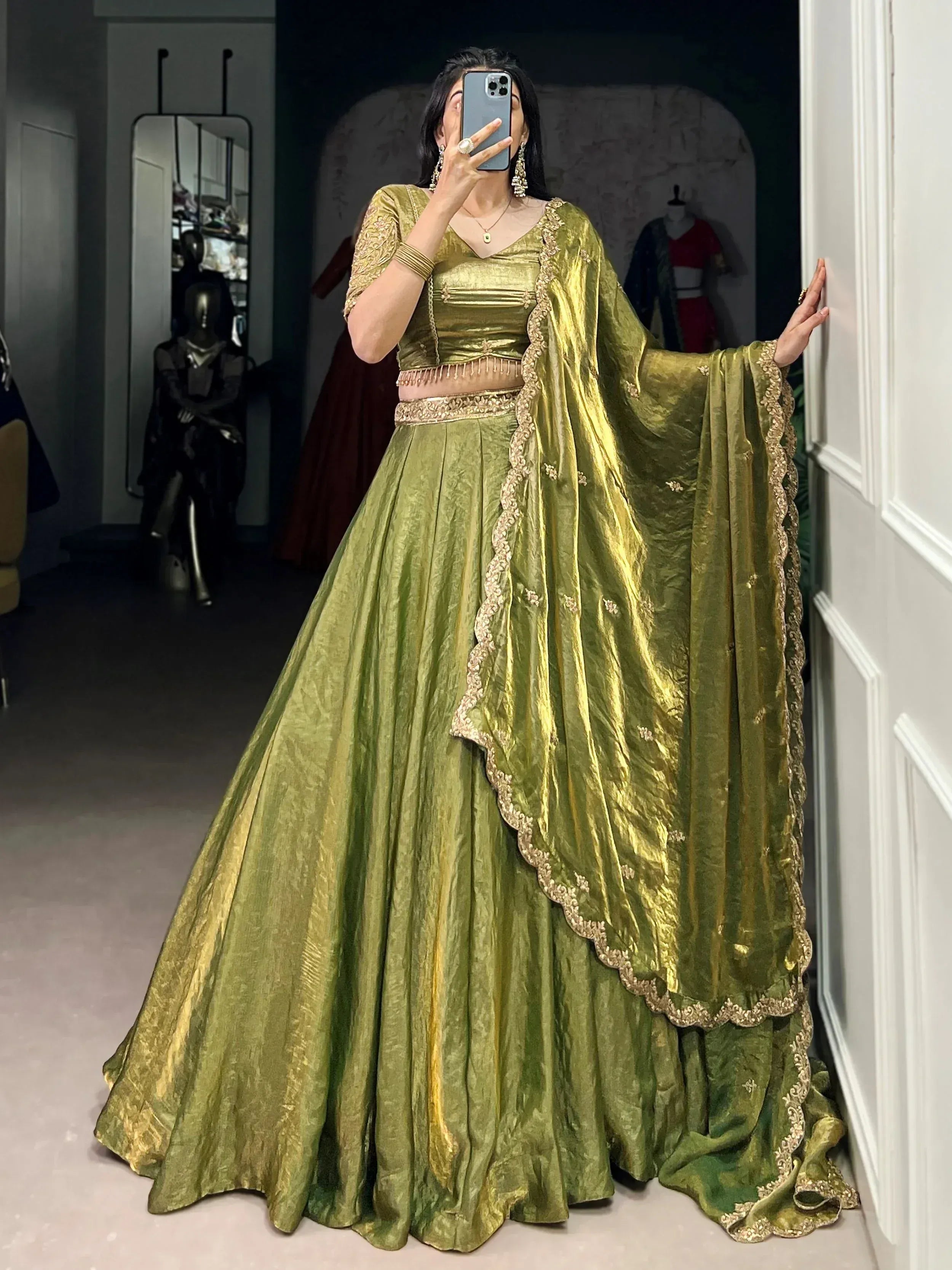 Olive green velvet lehenga choli with gold embroidery, perfect for Indian ethnic wear and festive occasions.