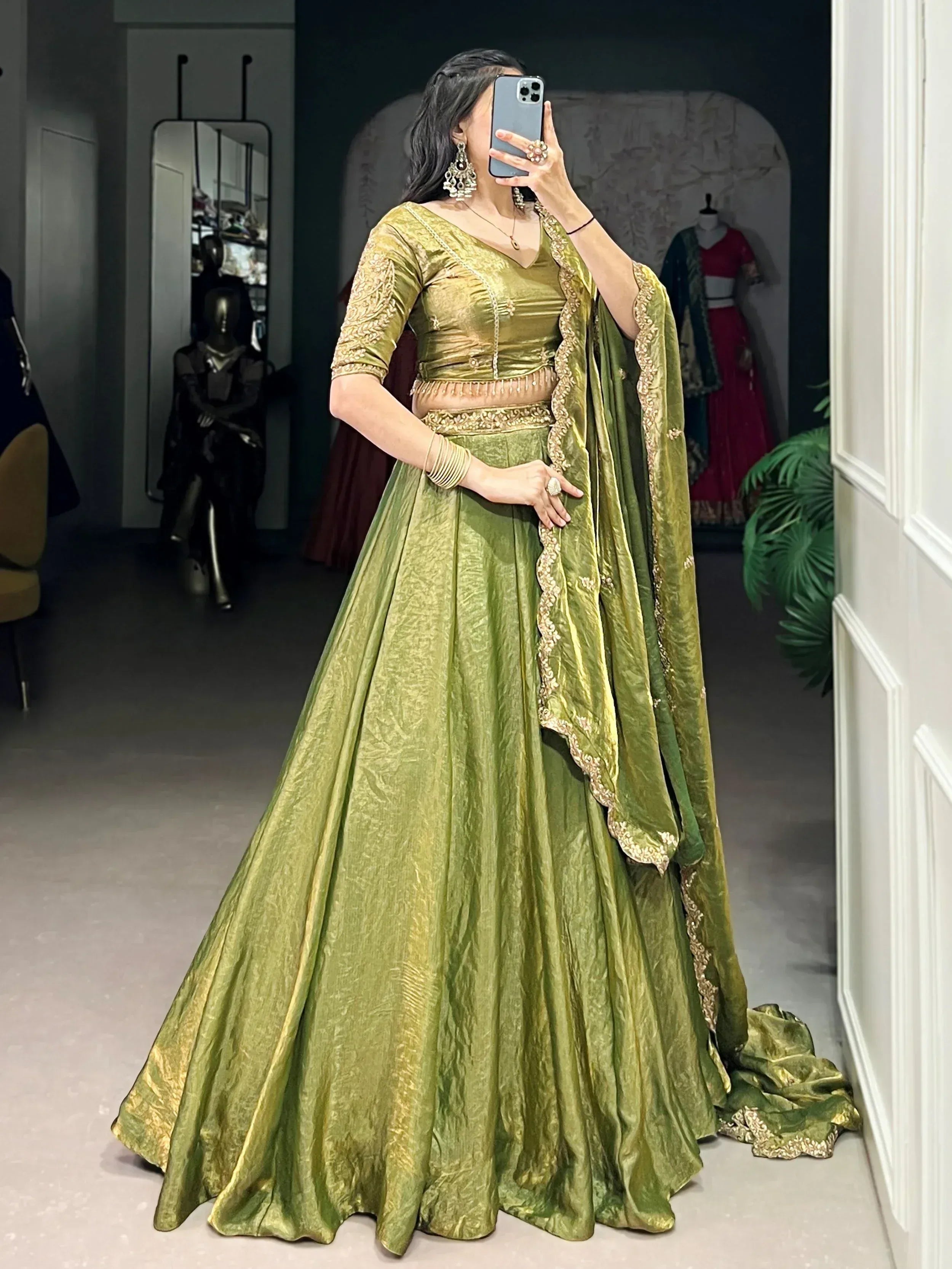 Elegant green velvet lehenga choli with gold embroidery, perfect for Indian weddings and festive occasions.