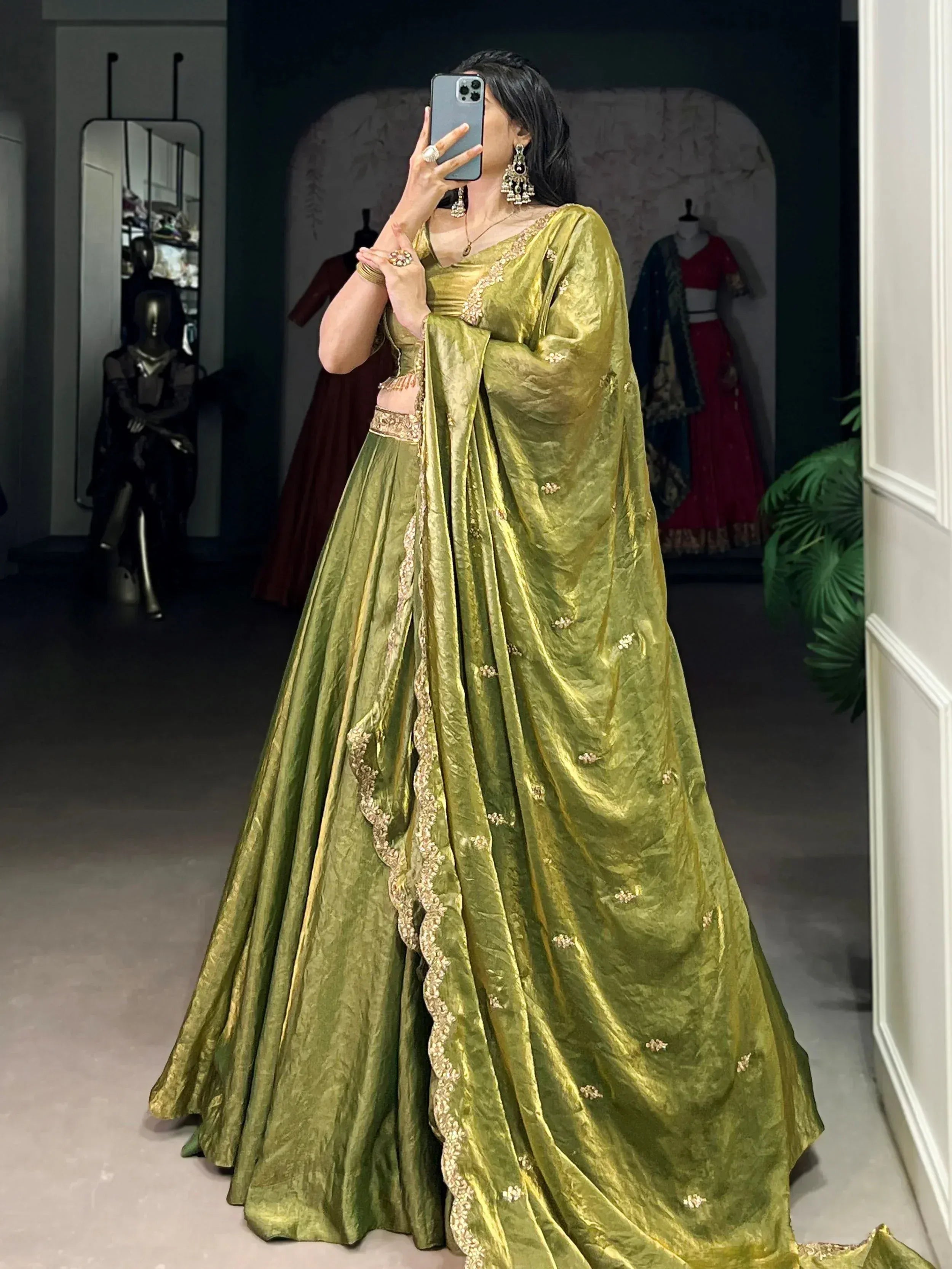 Olive green designer lehenga choli with gold embroidery, perfect for weddings and festive occasions.