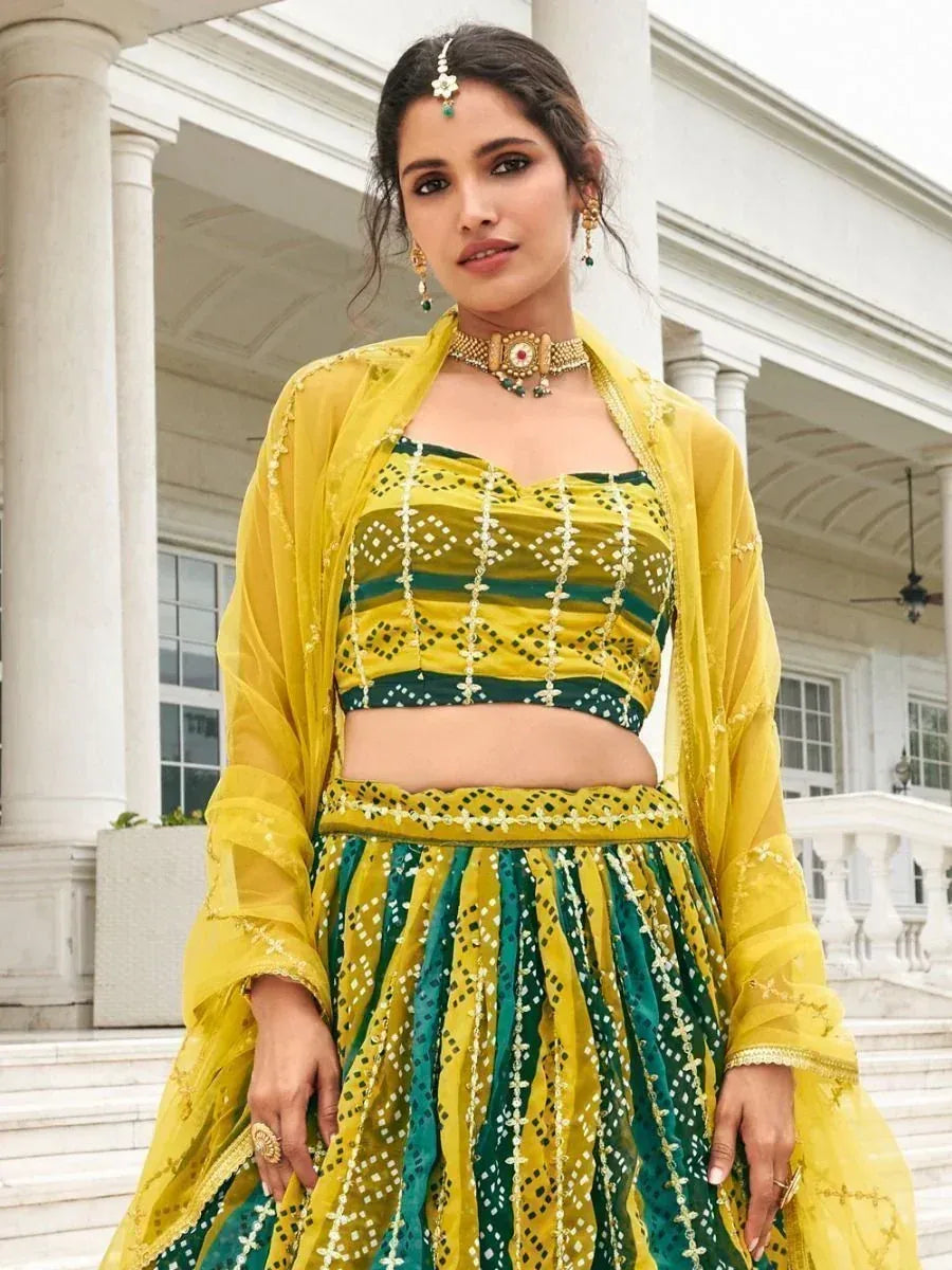 Yellow and green embroidered lehenga choli with sheer dupatta, perfect for Indian ethnic wear occasions