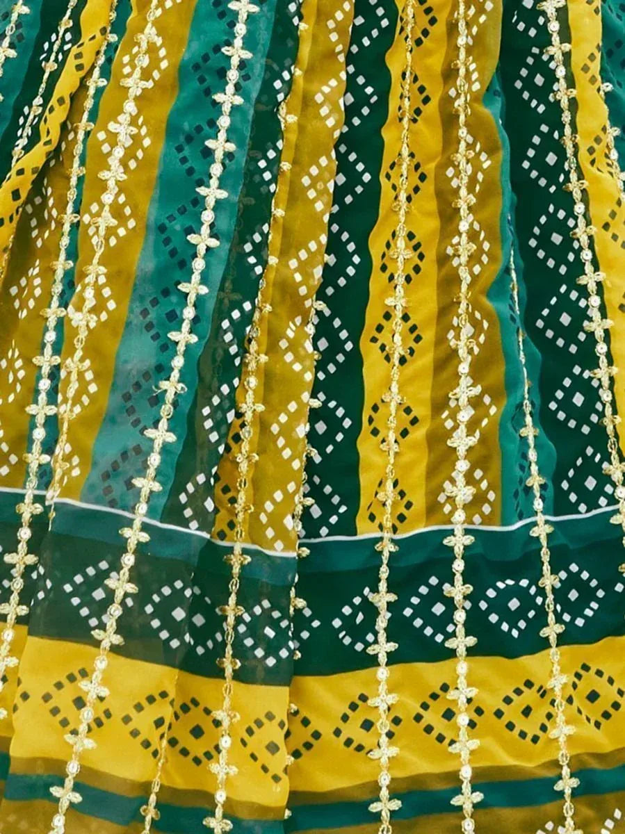 Green and yellow ethnic lehenga with gold embroidery and geometric patterns