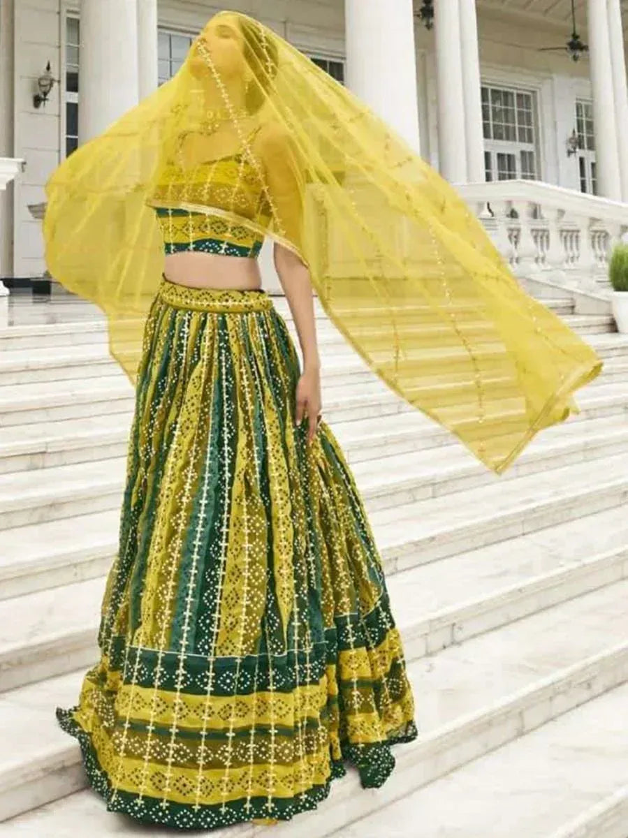 Yellow and green designer lehenga choli with flowing dupatta, ethnic Indian wear for weddings and festivals