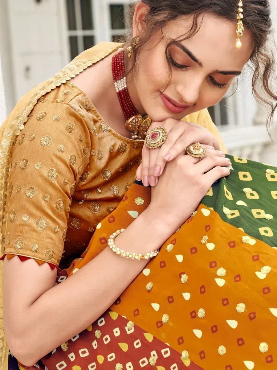 Woman in traditional Indian ethnic wear with gold embroidery, red beads, and statement jewelry