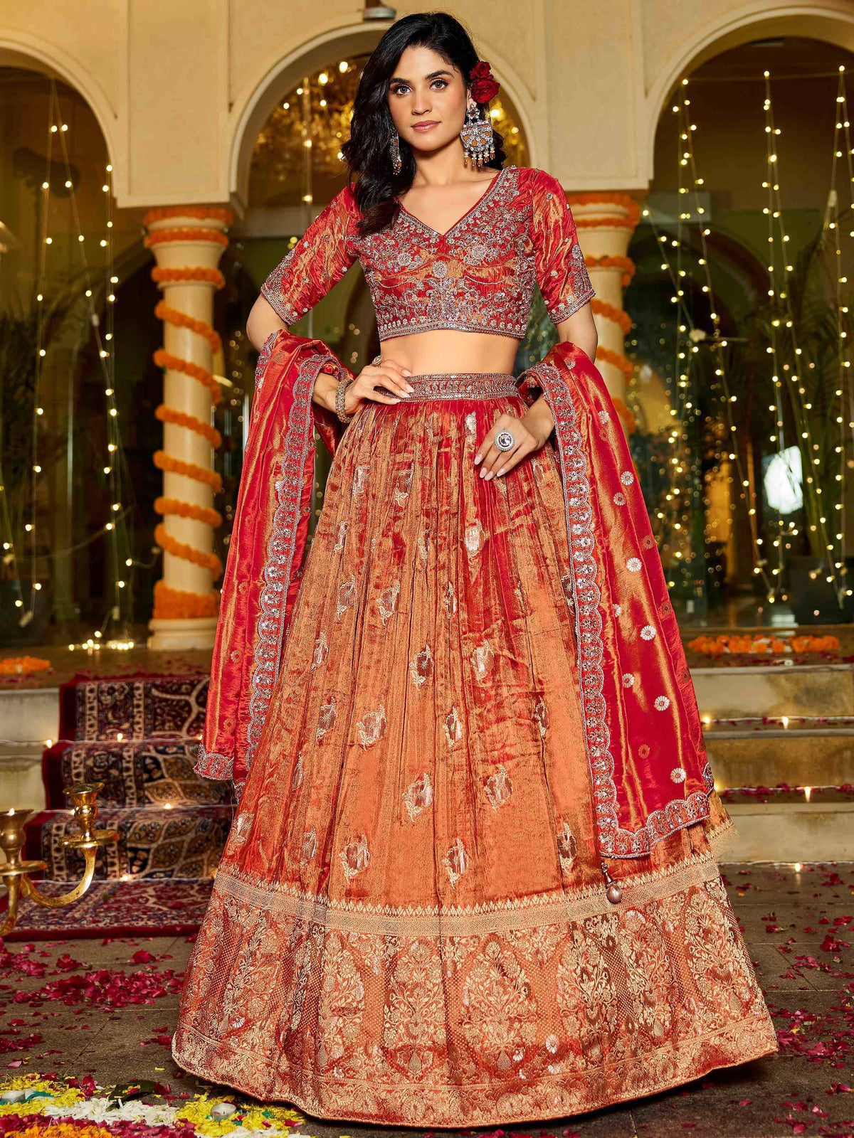 Red and gold embroidered lehenga choli with dupatta, perfect for Indian weddings and festive occasions.