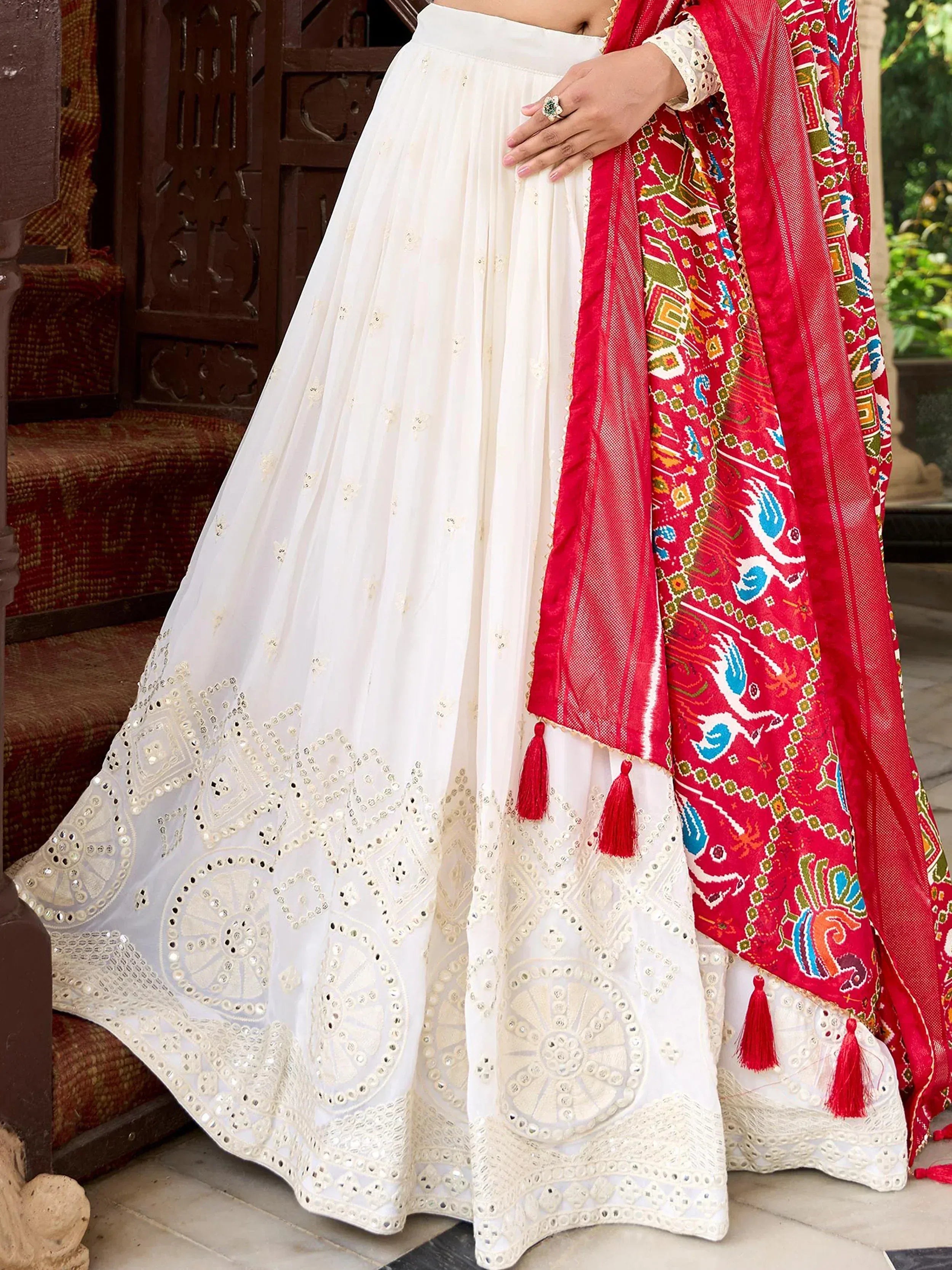 White embroidered lehenga with red patterned dupatta, traditional Indian ethnic wear for festive occasions